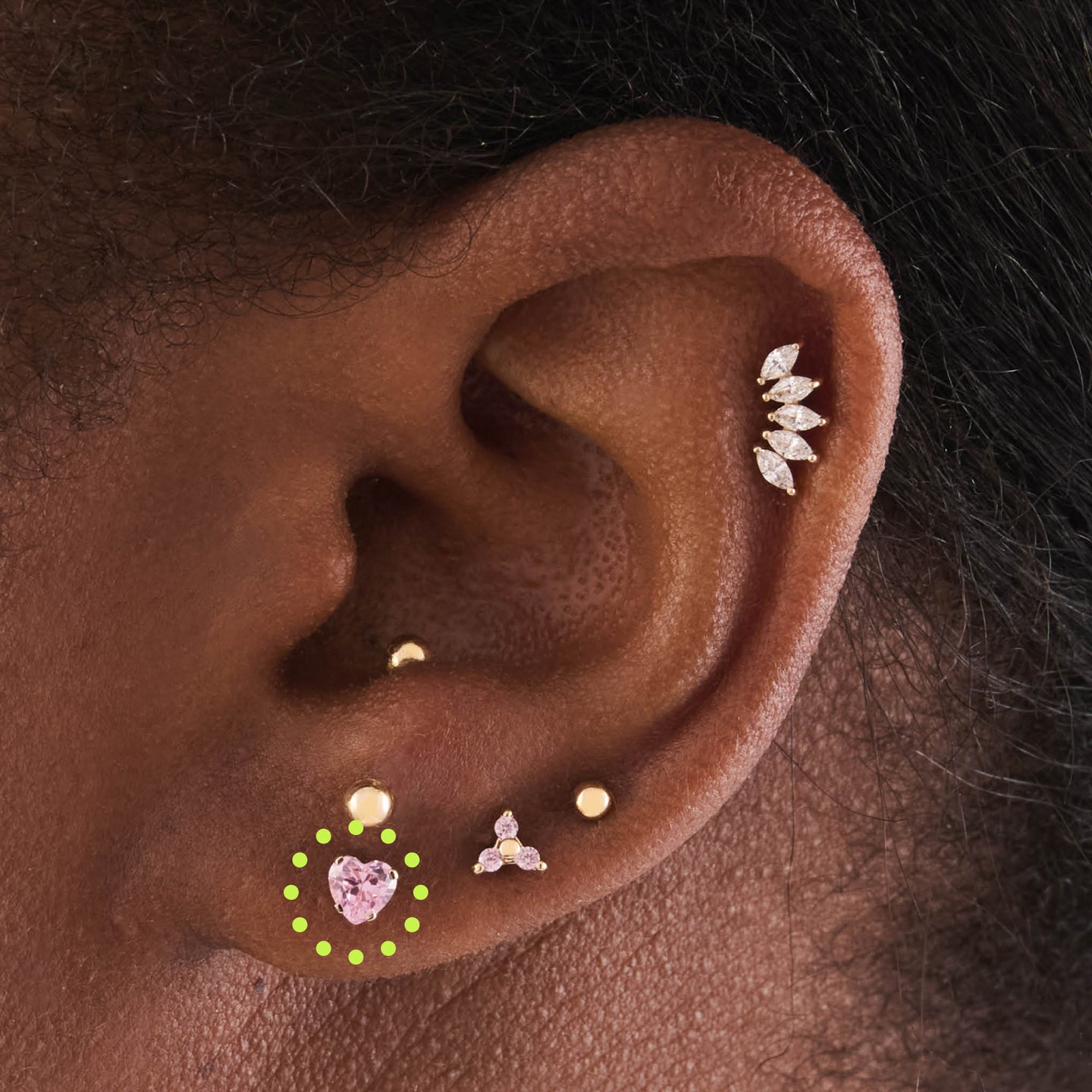 on ear featuring a 14k heart cz flatback in gold with a pink stone [hover] color:null|gold/pink