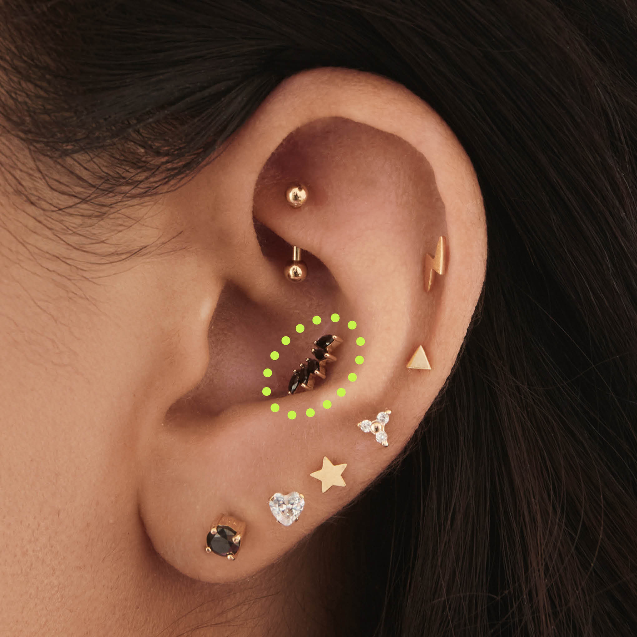 This is an image of a 14k gold flatback with a crown marquise cz setting and black cz stone on ear. [hover] color:null|14k gold/black