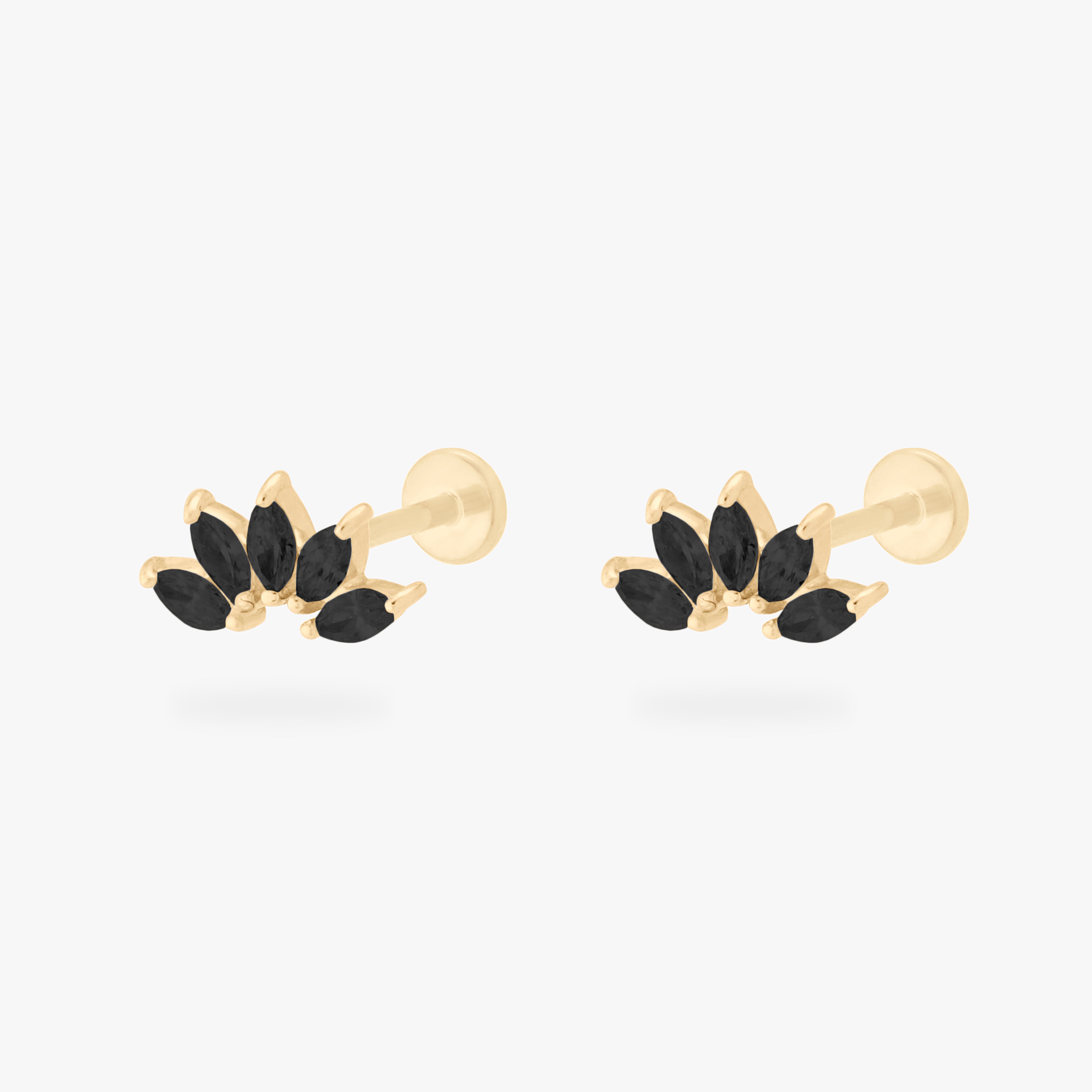 This is an image of a pair of 14k gold flatbacks with crown marquise cz settings and black cz stones. [pair] color:null|14k gold/black