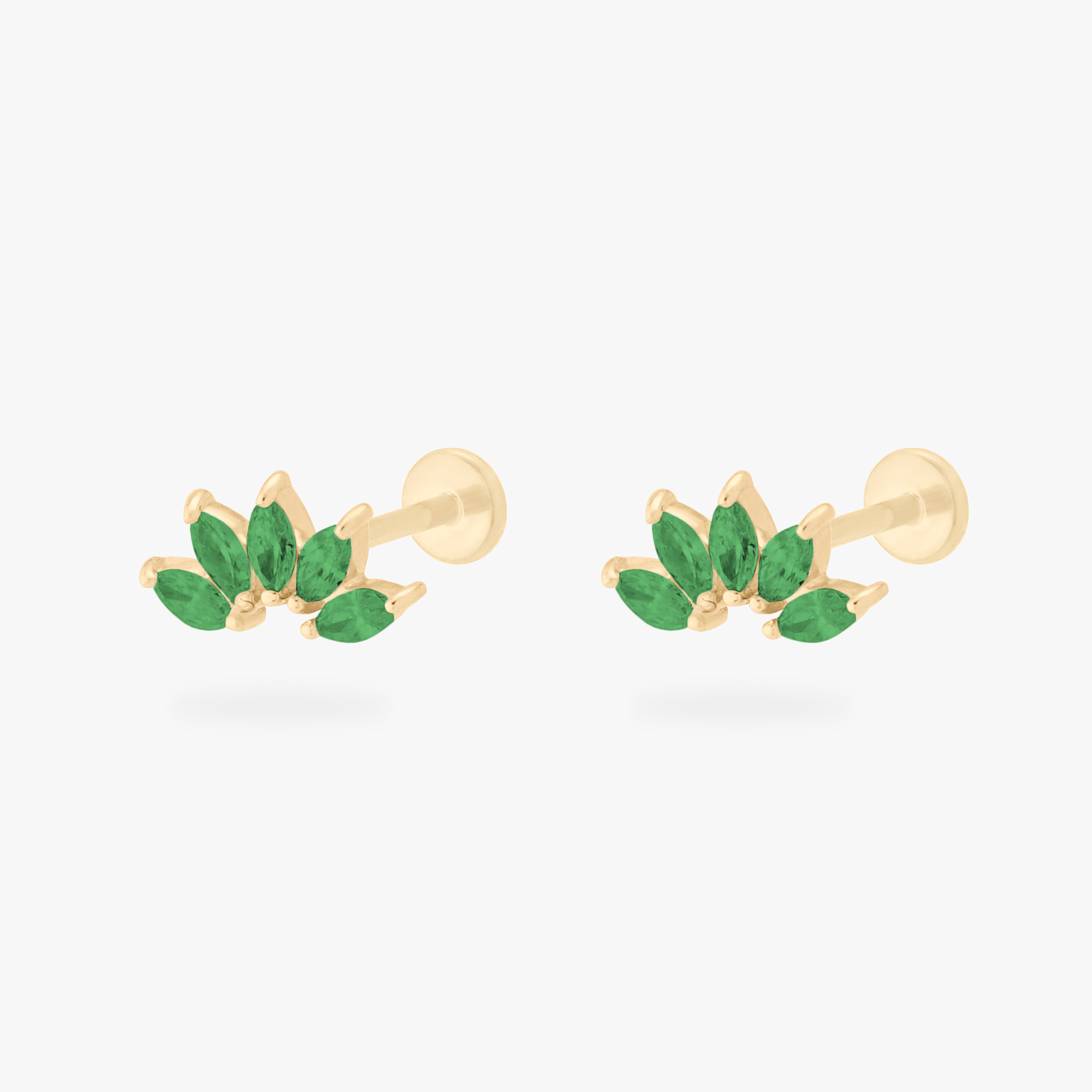 This is an image of a pair of 14k gold flatbacks with crown marquise cz settings and green cz stones. [pair] color:null|14k gold/green