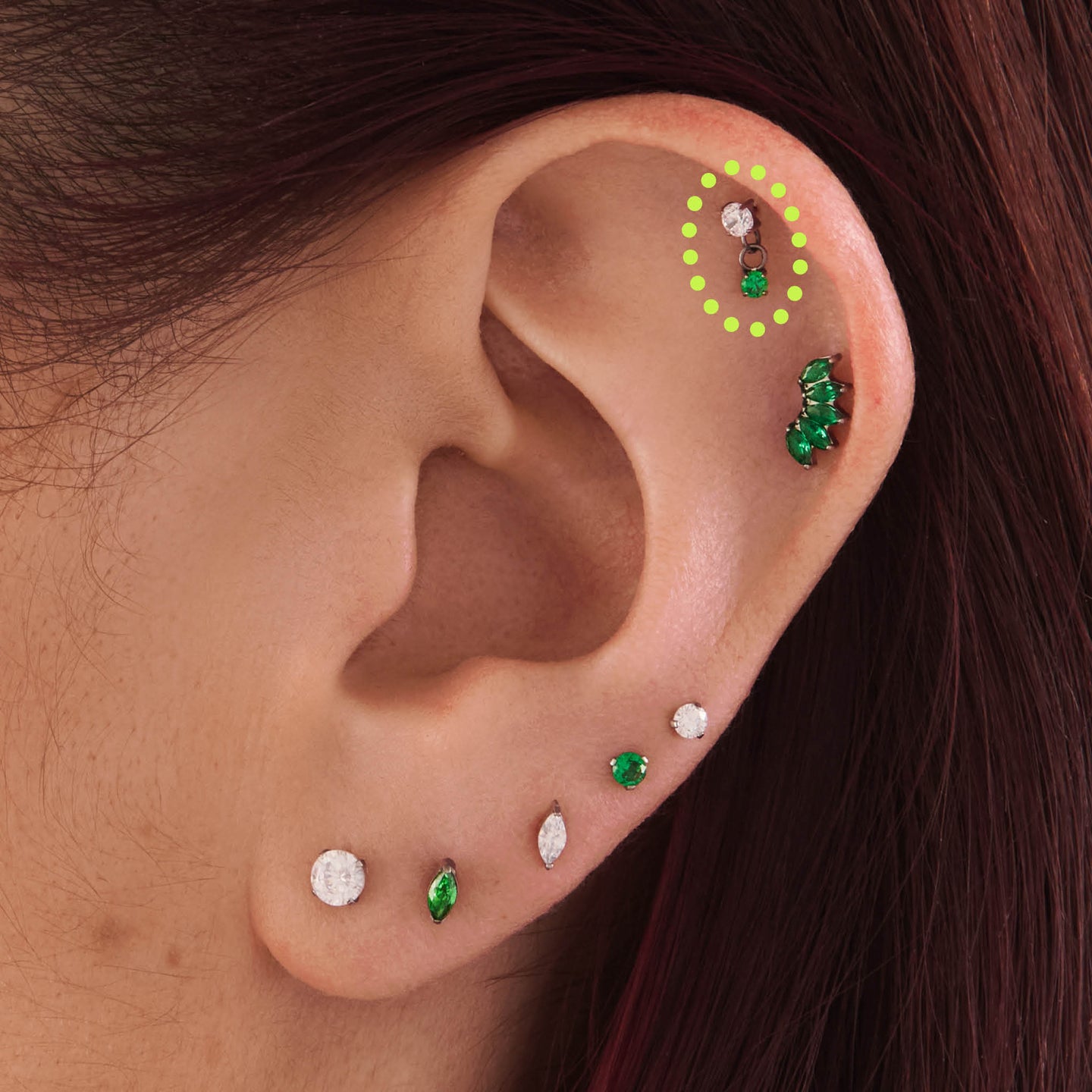 on ear featuring a titanium cz dangle flatback with a clear and green cz stone [hover] color:null|silver/green