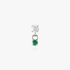 This image is a silver toned titanium flatback stud that features a larger crystal CZ stone with a smaller green CZ stone dangling from it against a white background.
