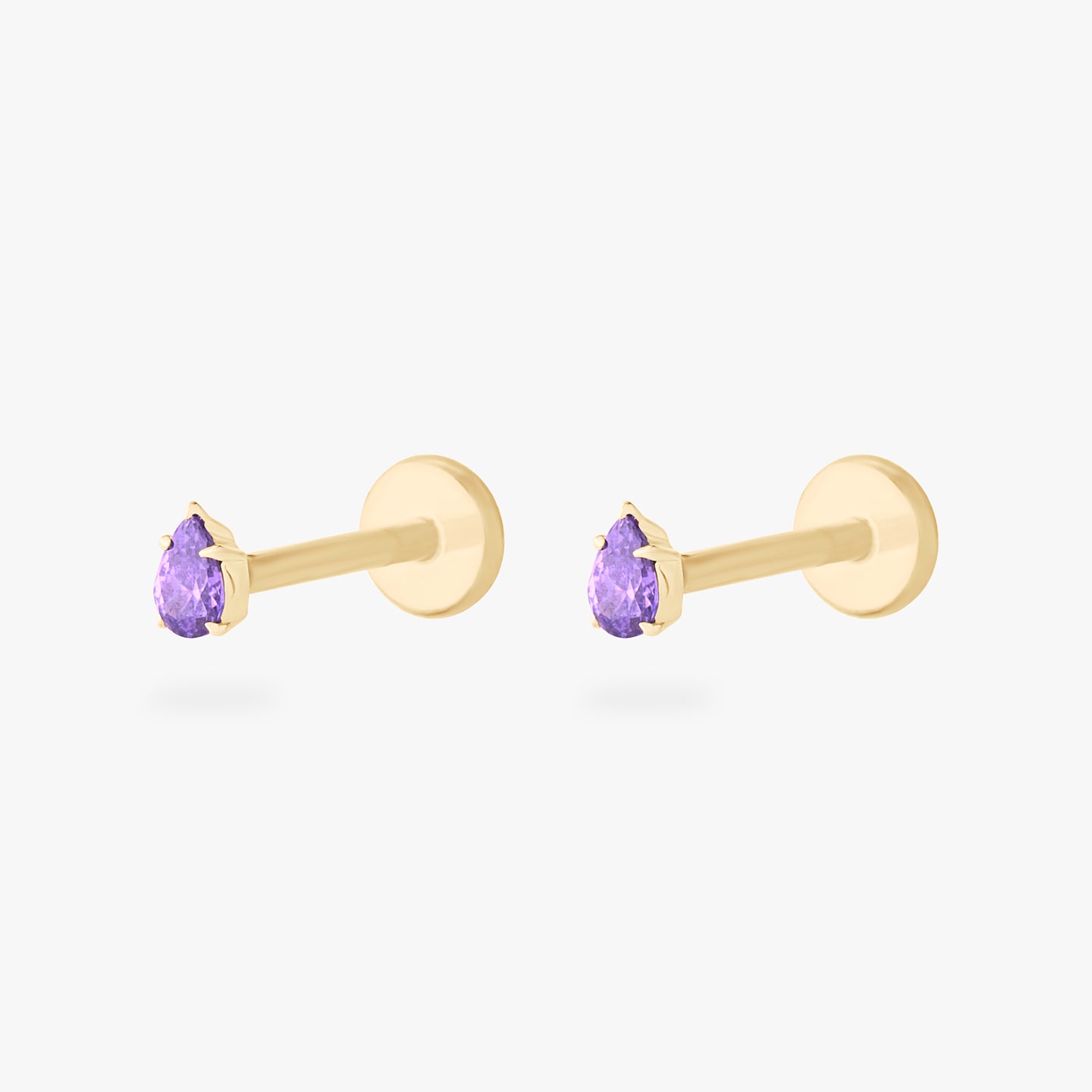 This is a pair of 14K gold flatback studs with pear shaped amethyst cz stones. [pair] color:null|amethyst