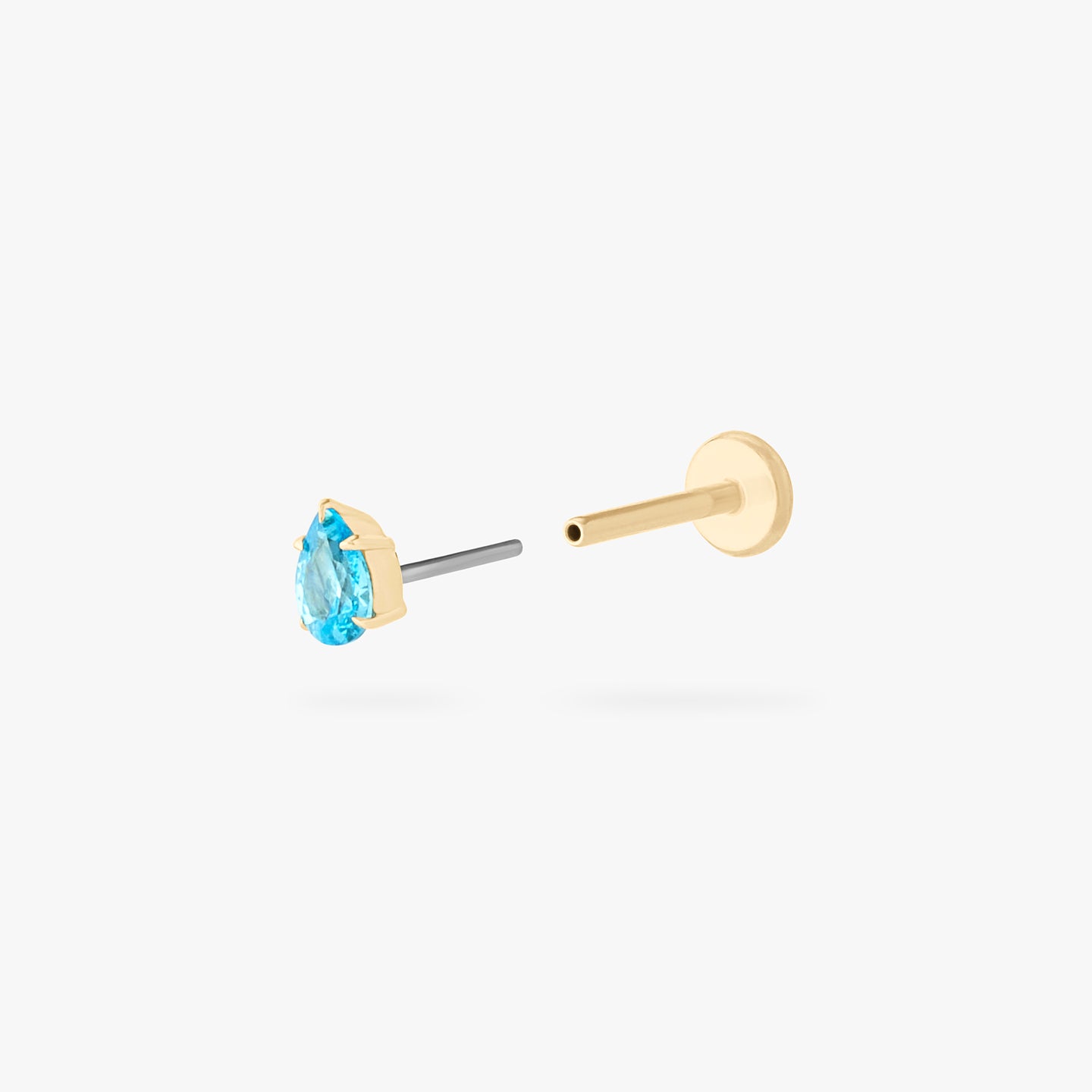 This is a 14K gold flatback stud with a pear shaped aquamarine cz stone. color:null|aquamarine