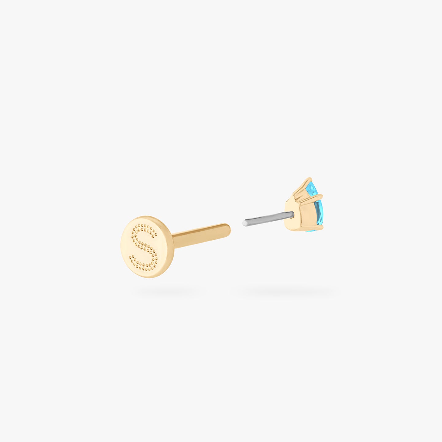 This is a 14K gold flatback stud with a pear shaped aquamarine cz stone. color:null|aquamarine