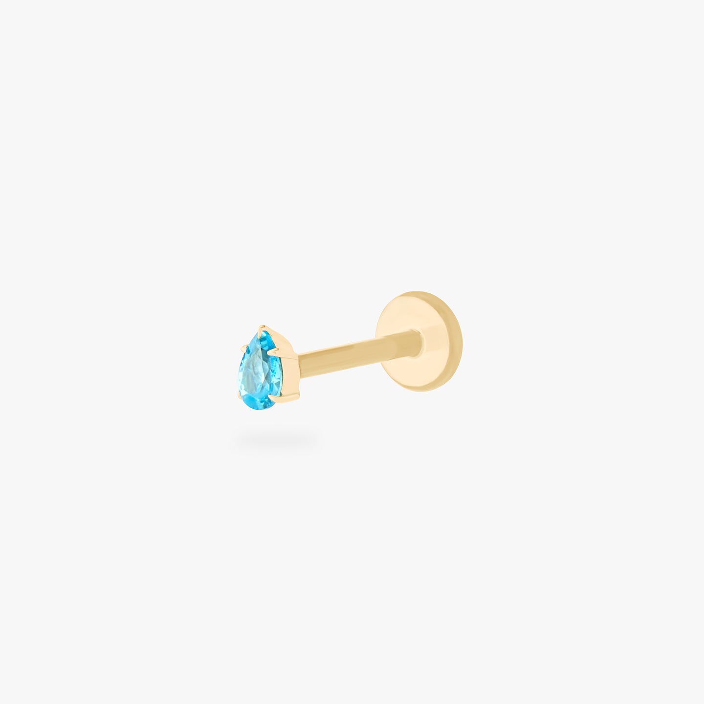 This is a 14K gold flatback stud with a pear shaped aquamarine cz stone. color:null|aquamarine