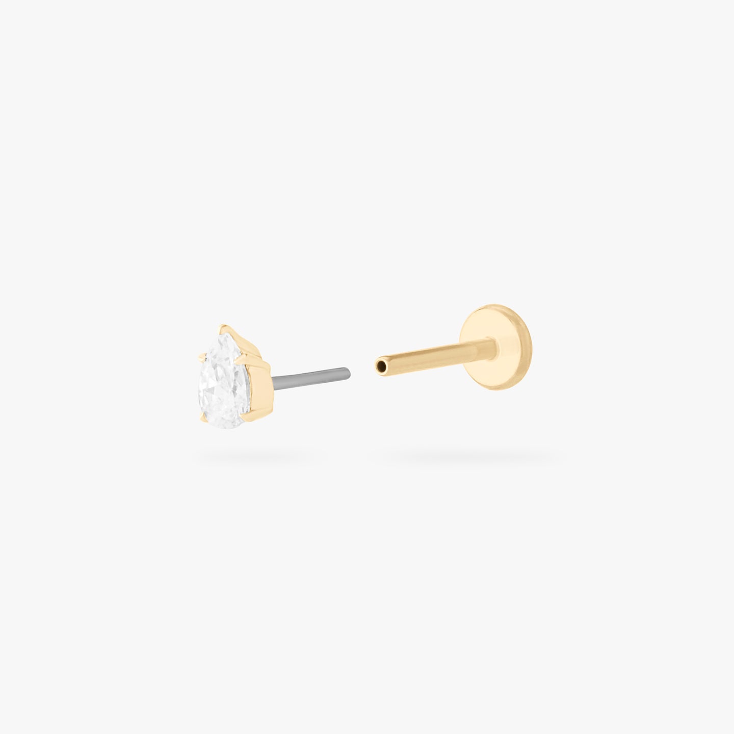 This is a 14K gold flatback stud with a pear shaped crystal cz stone. color:null|crystal