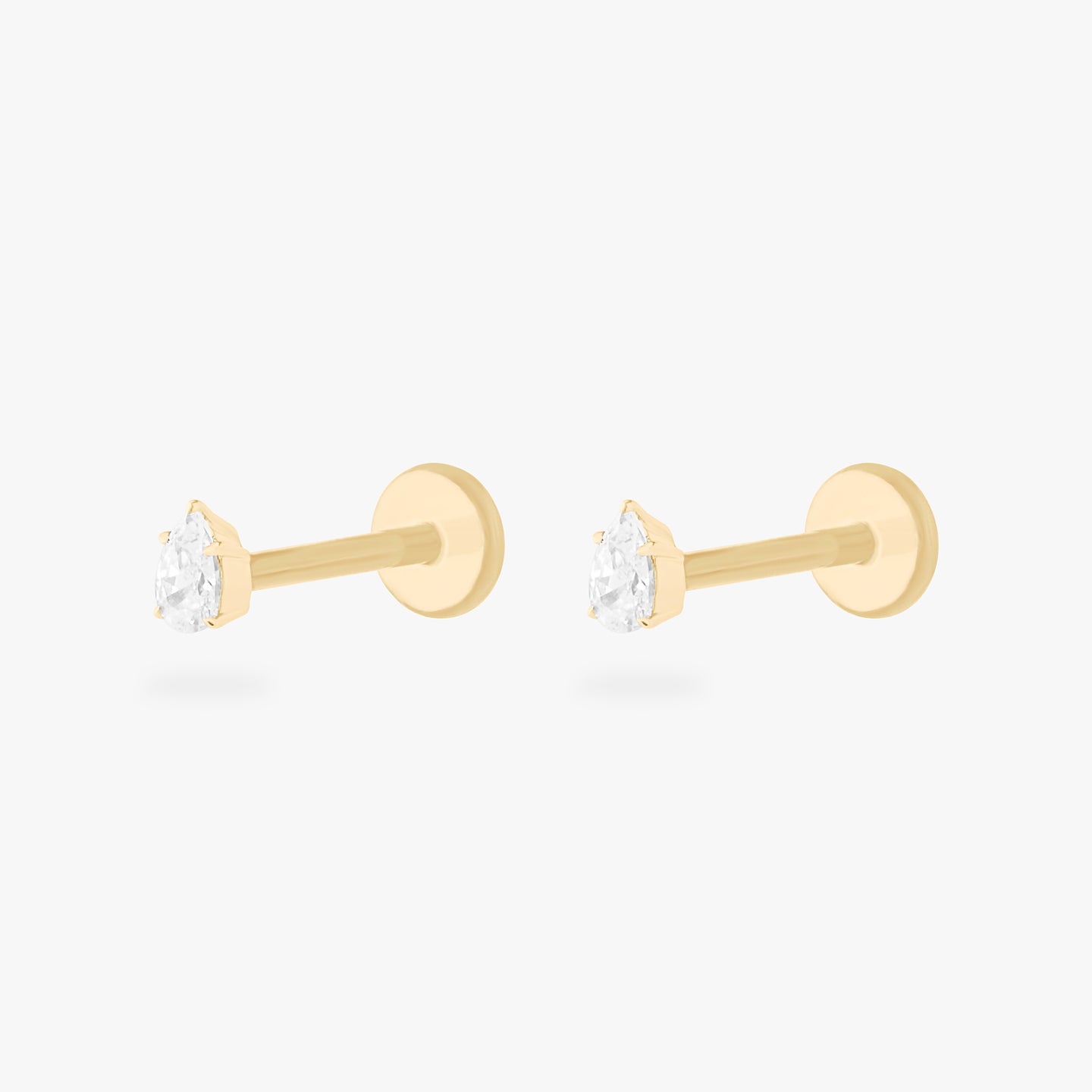 This is a pair of 14K gold flatback studs with pear shaped crystal cz stones. [pair] color:null|crystal