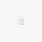 This image is a 14K gold flatback stud with a pear shaped crystal cz stone against a white background. 