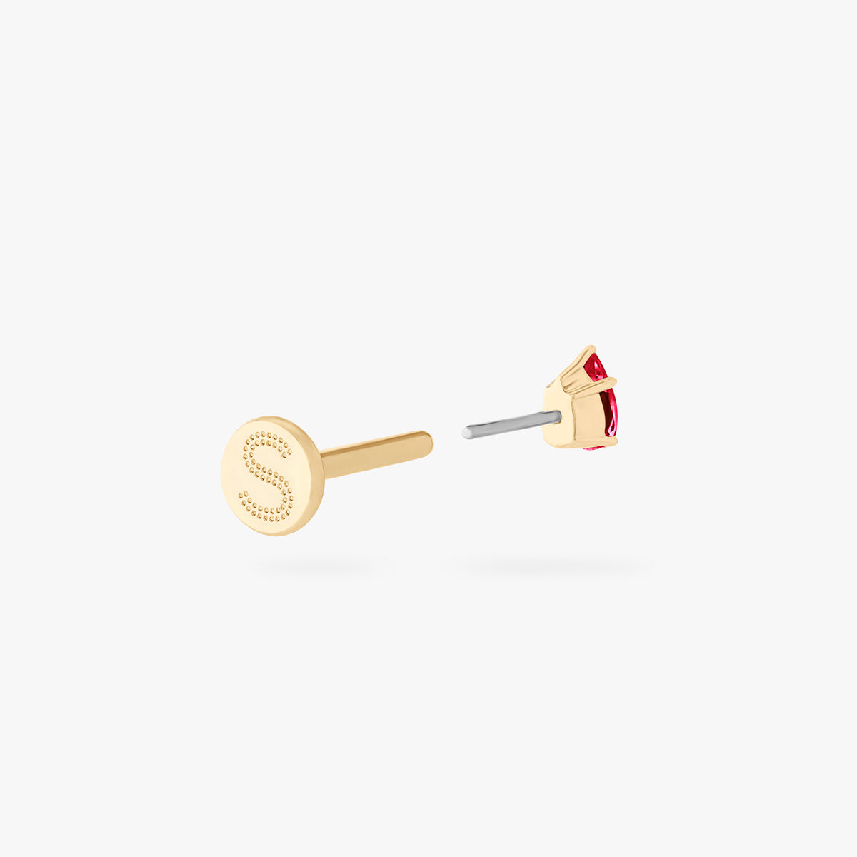 This is an image of a 14K gold flatback stud with a pear shaped garnet cz stone against a white background. This image shows the flatback stud pieces separated, and focuses on the Studs "S" on the flatback post.