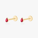 This is a pair of 14K gold flatback studs with pear shaped garnet cz stones. 