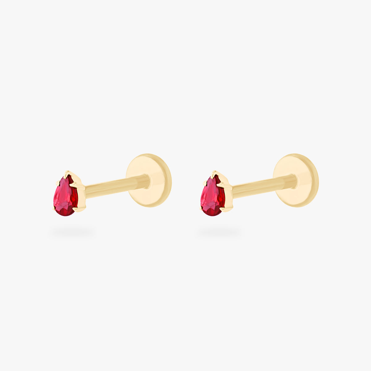 This is a pair of 14K gold flatback studs with pear shaped garnet cz stones. 