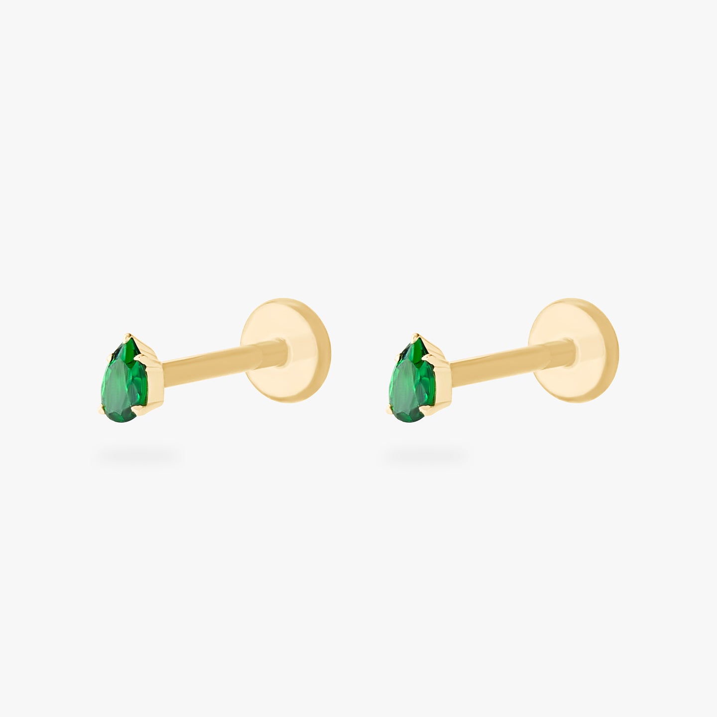 This is a pair of 14K gold flatback studs with pear shaped emerald cz stones. [pair] color:null|emerald