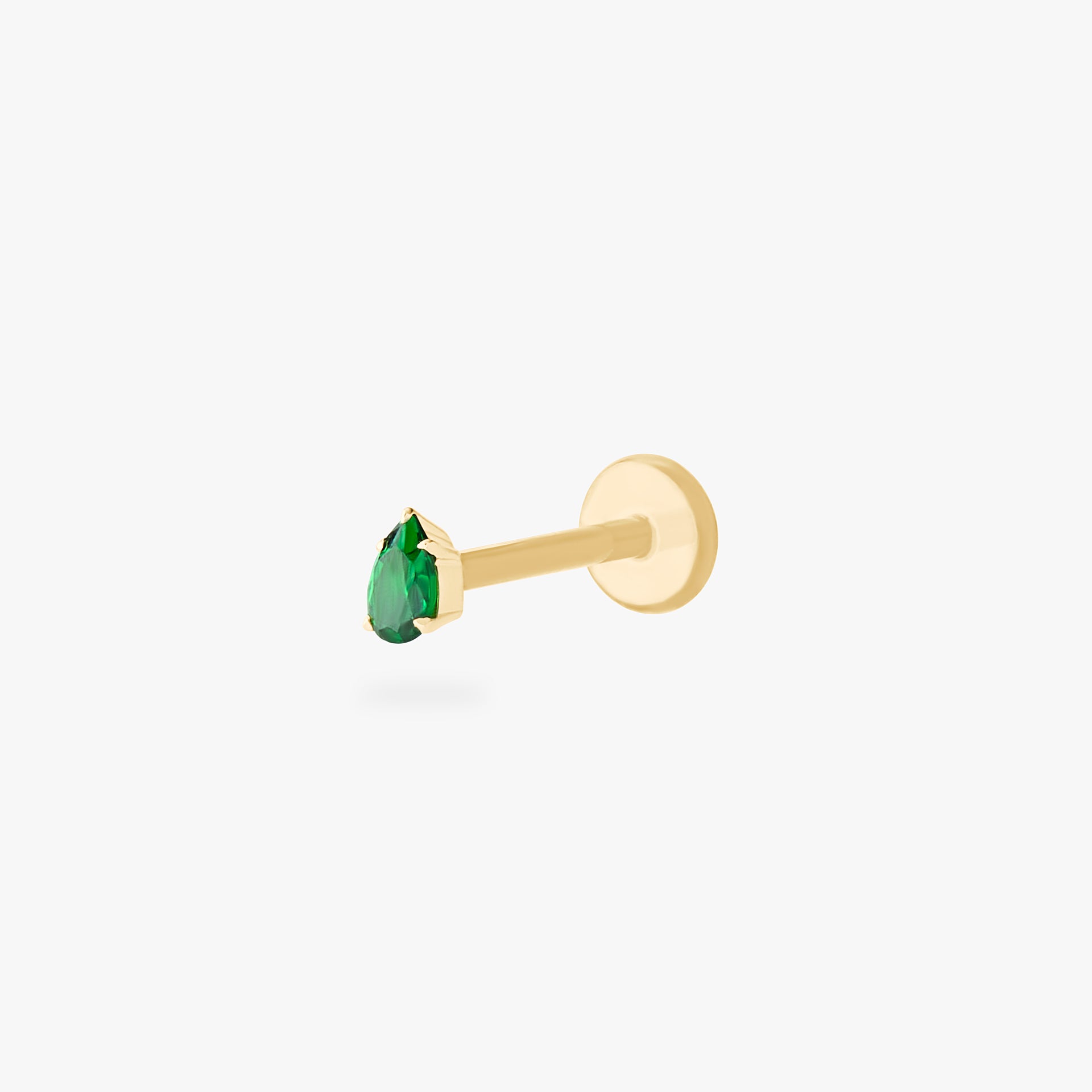 This is a 14K gold flatback stud with a pear shaped emerald cz stone. - Main view