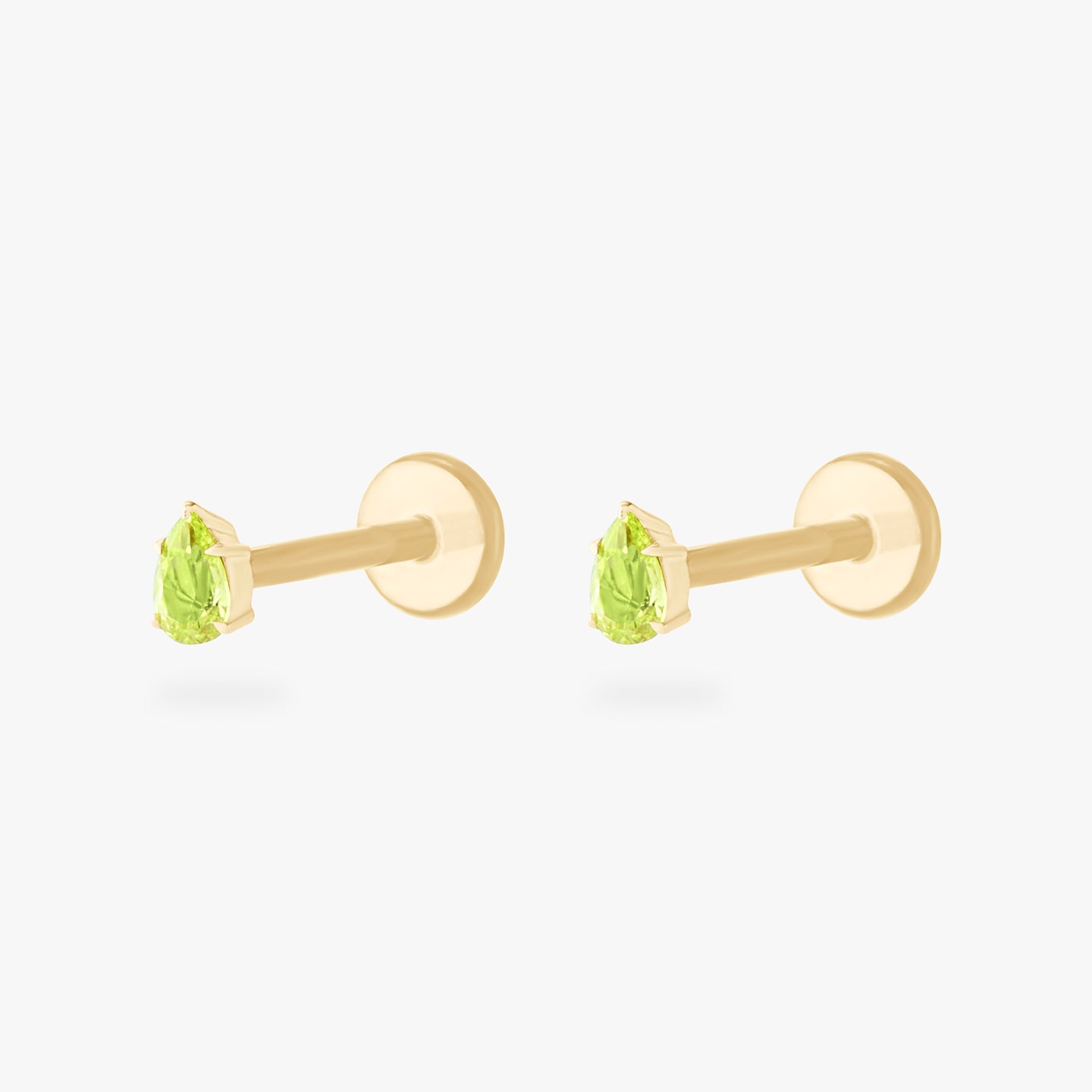 This is a pair of 14K gold flatback studs with pear shaped peridot cz stones. [pair] color:null|peridot