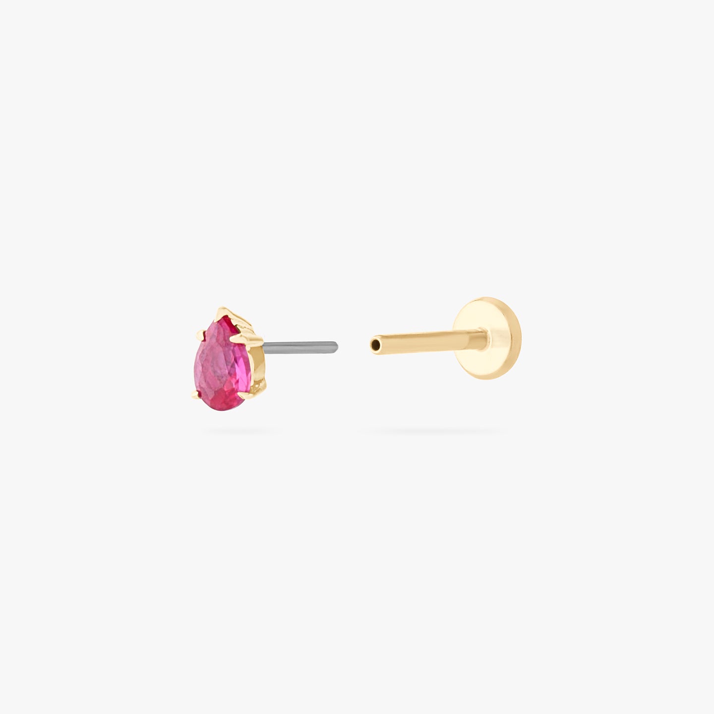 This is a 14K gold flatback stud with a pear shaped ruby cz stone. color:null|ruby