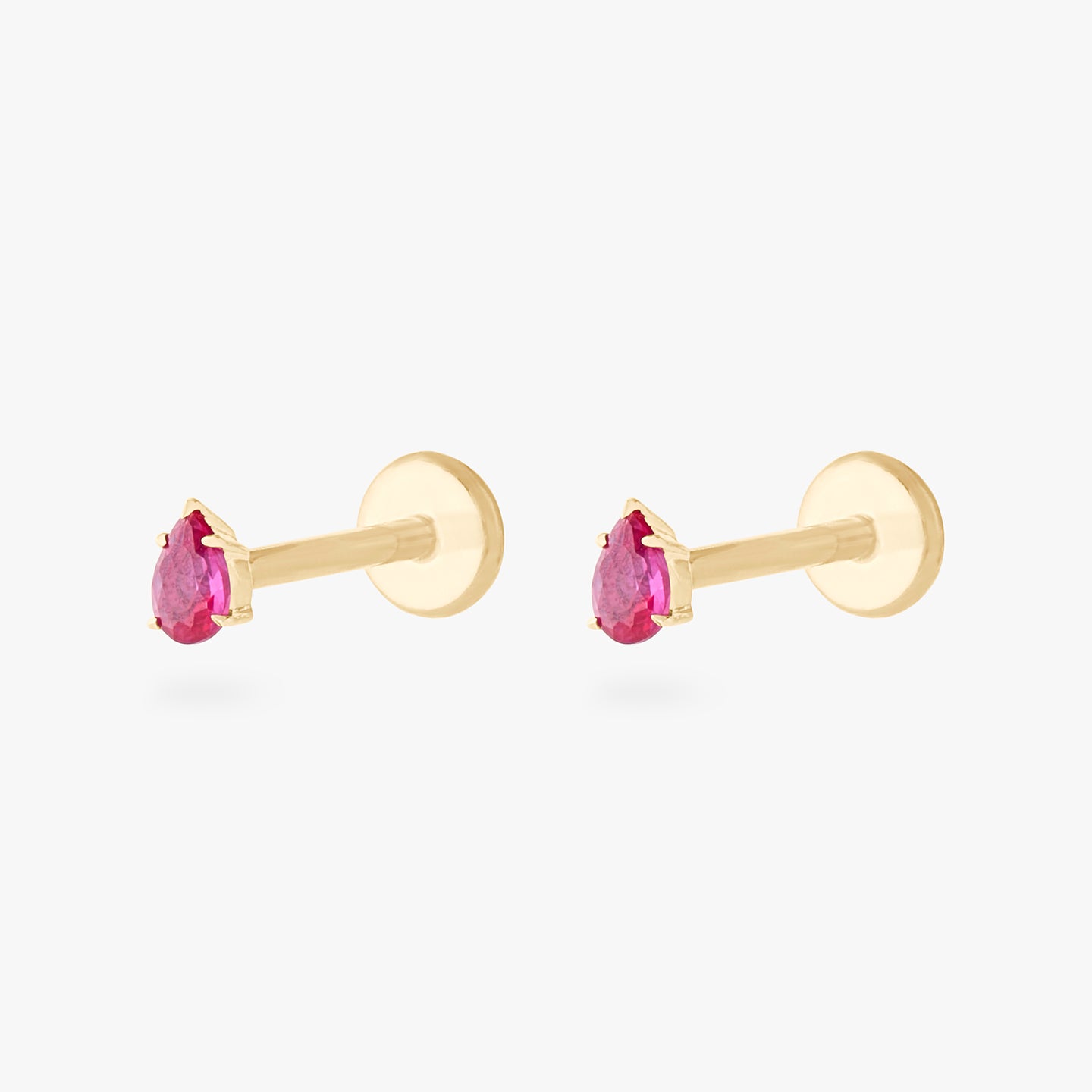 This is a pair of 14K gold flatback studs with pear shaped ruby cz stones. [pair] color:null|ruby