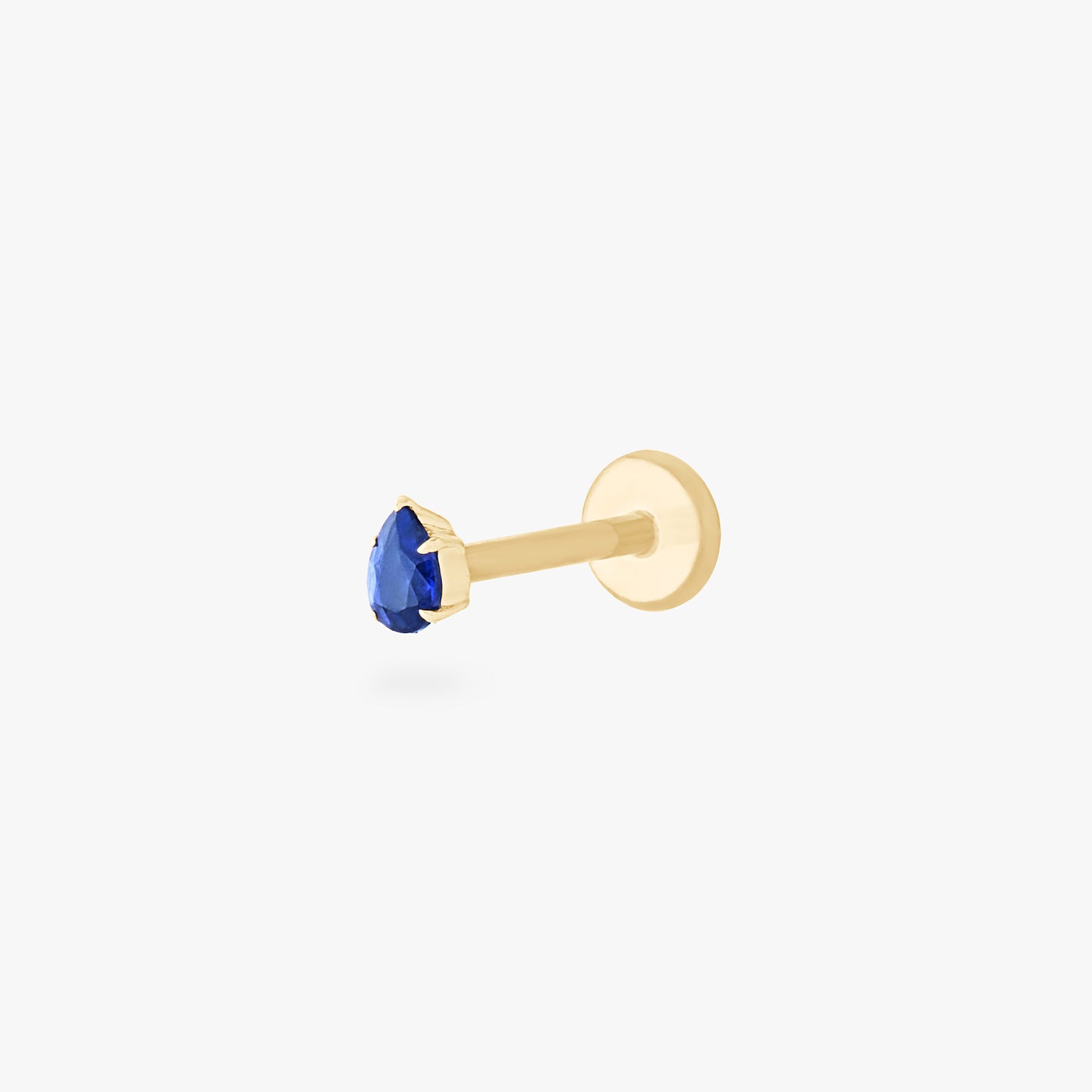 This is a 14K gold flatback stud with a pear shaped sapphire cz stone. color:null|sapphire