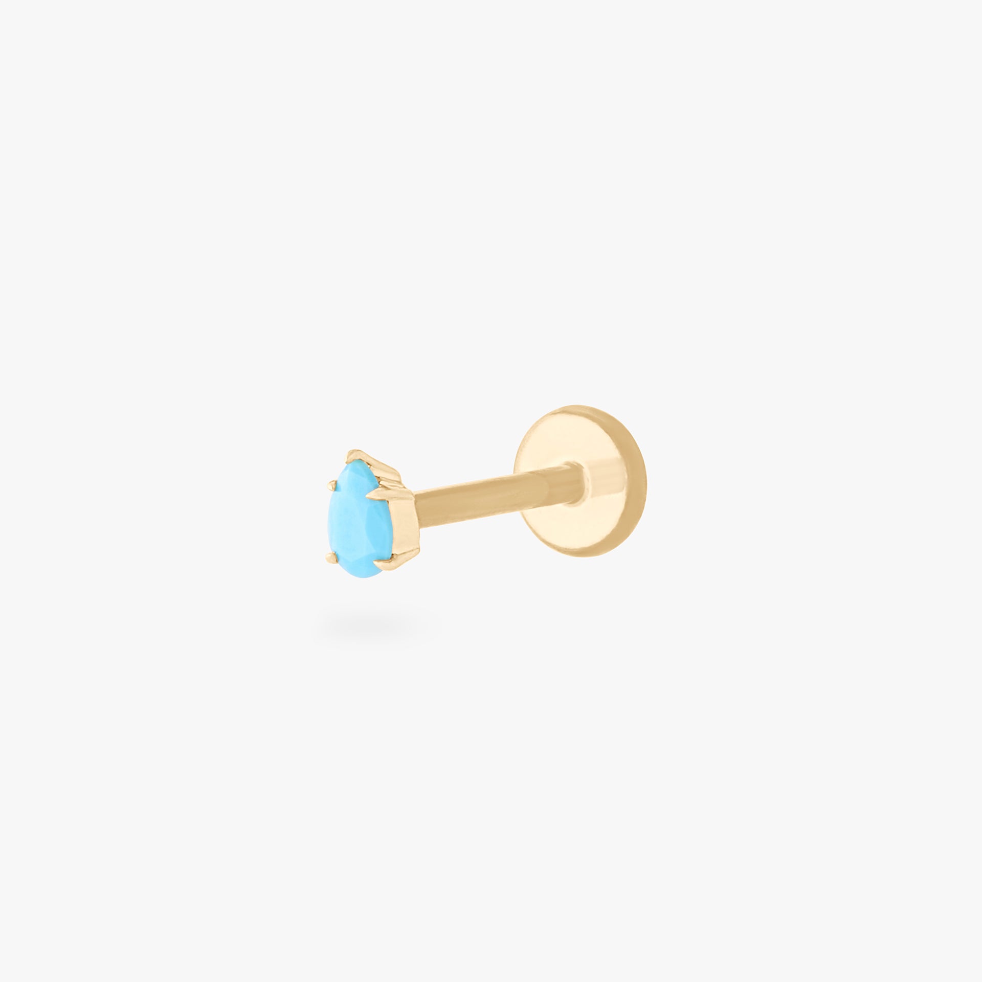 This is a 14K gold flatback stud with a pear shaped turquoise cz stone. - Main view