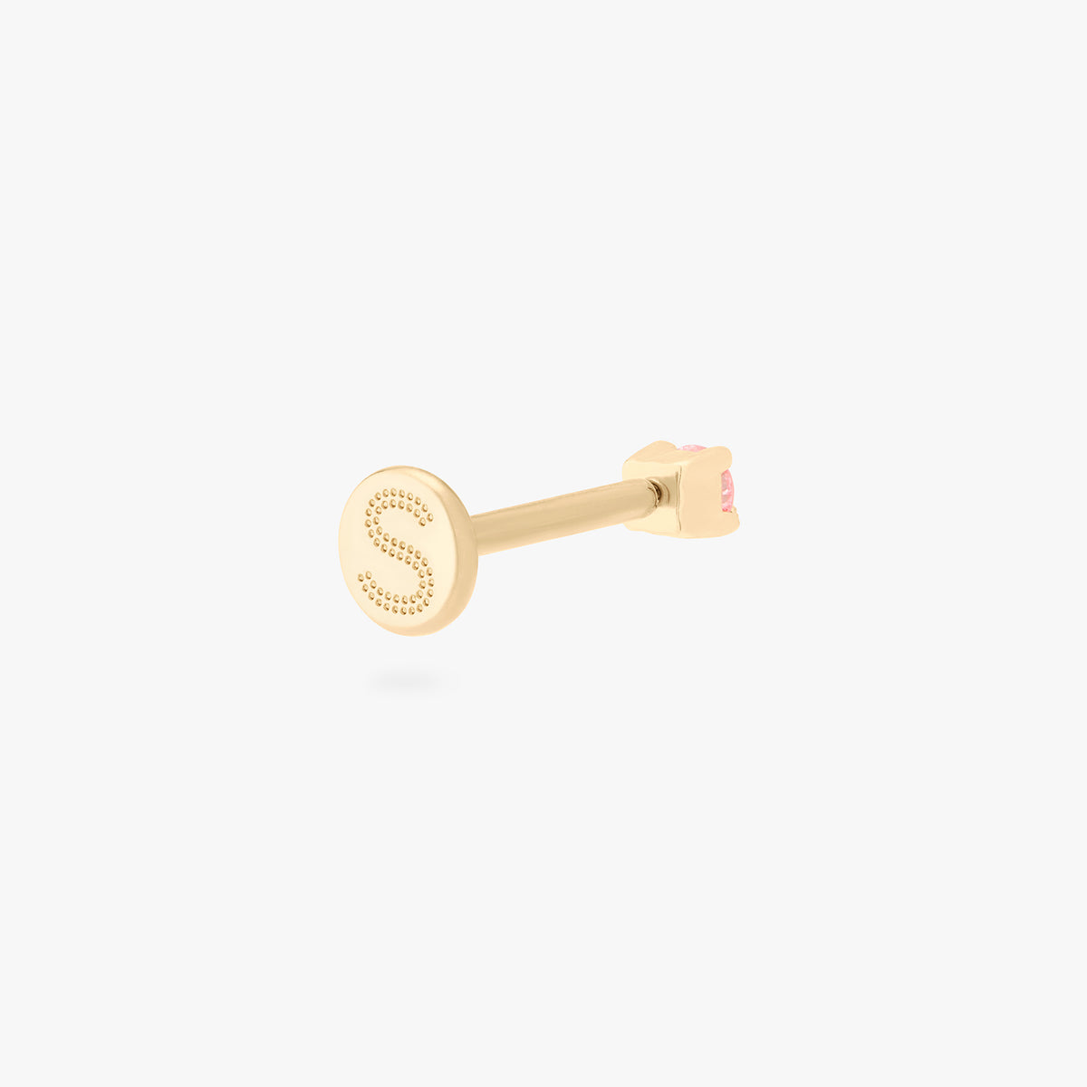 This image shows a flatback stud made of 14K gold with a round pink diamond stone facing backwards and the gold-toned labret back on. 