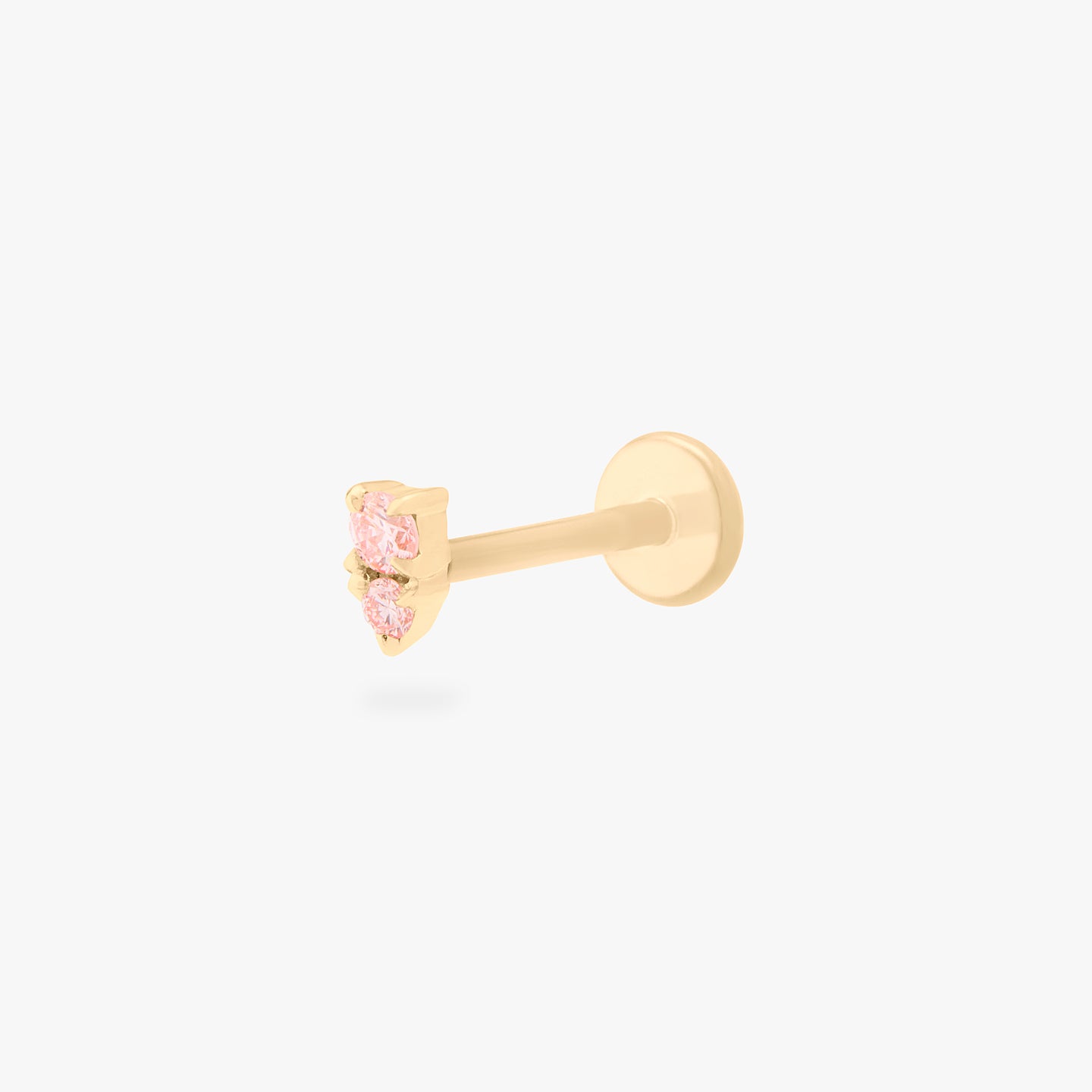 This image shows a flatback stud made of 14K gold with a round pink diamond stone stacked over a small triangular pink diamond stone and the gold-toned labret back on. color:null|pink|gold/pink