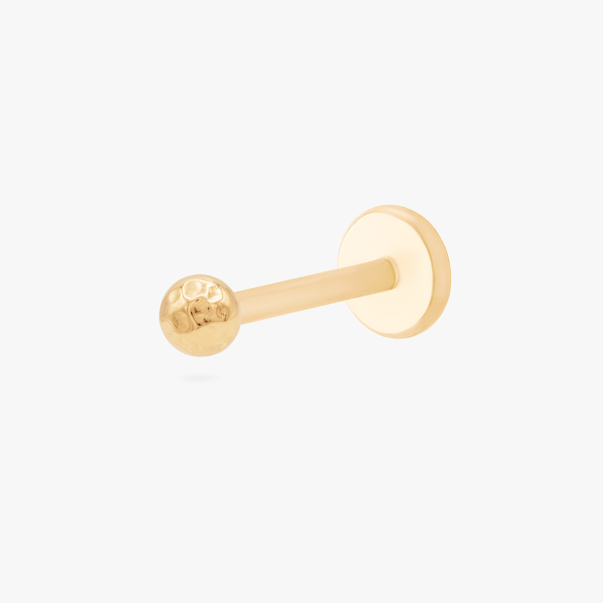 this image shows the side view of a 14k hammered dot flatback connected to labret 
