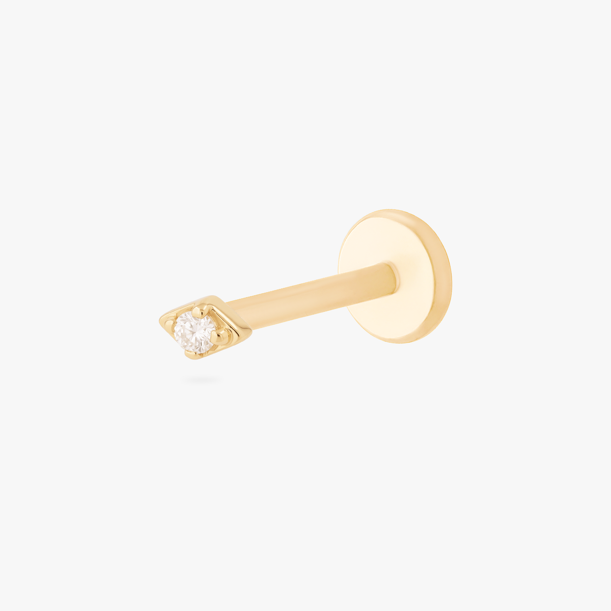 this image shows the side view of a 14k gold kite flatback with a clear cz stone in the middle 