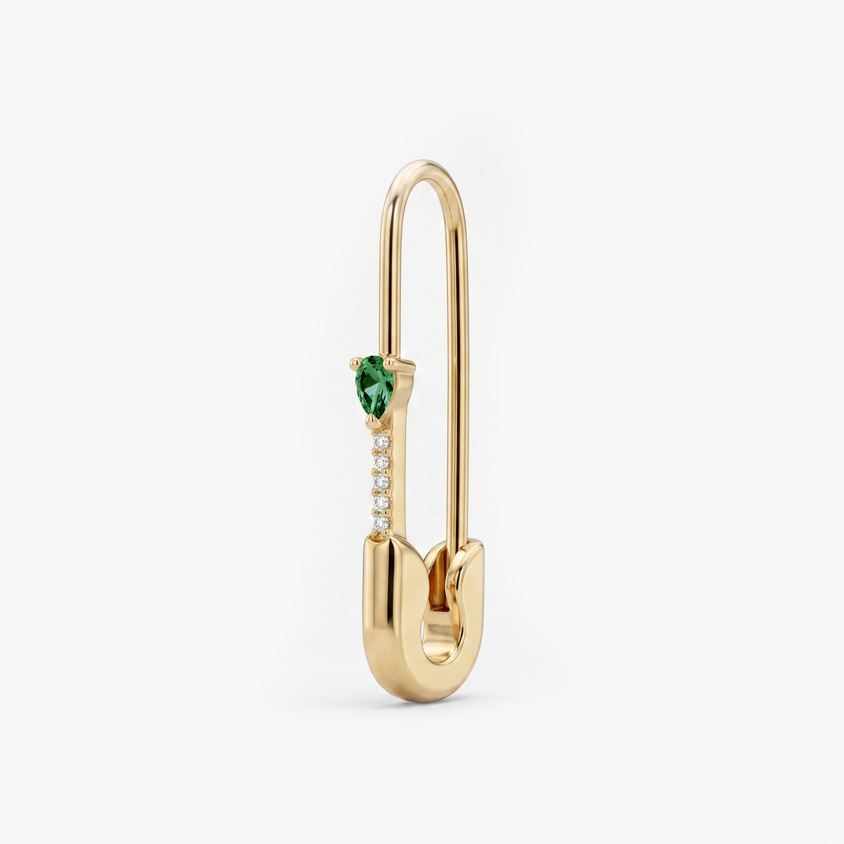 This is an image of a 14k yellow gold plated brass earring shaped like a safety pin with a green, pear cut CZ stone and 5 clear accent stones below the pear CZ. 