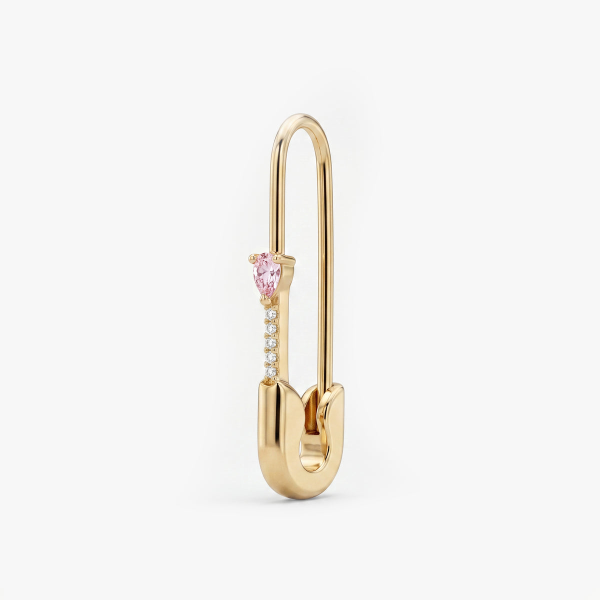 This is an image of a 14k yellow gold plated brass earring shaped like a safety pin with a pink pear cut CZ stone and 5 clear accent stones below the pear CZ. 