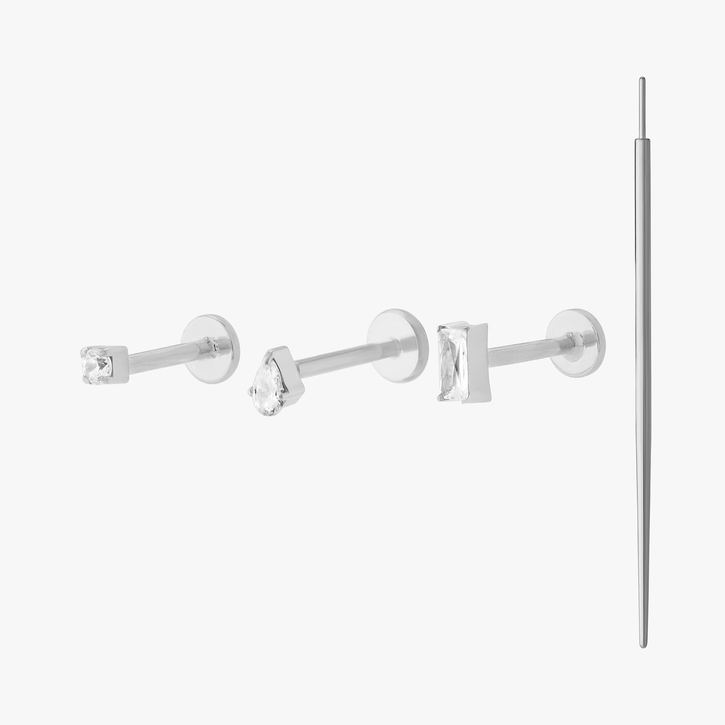 set of flatbacks with an insertion tool color:null|silver/clear