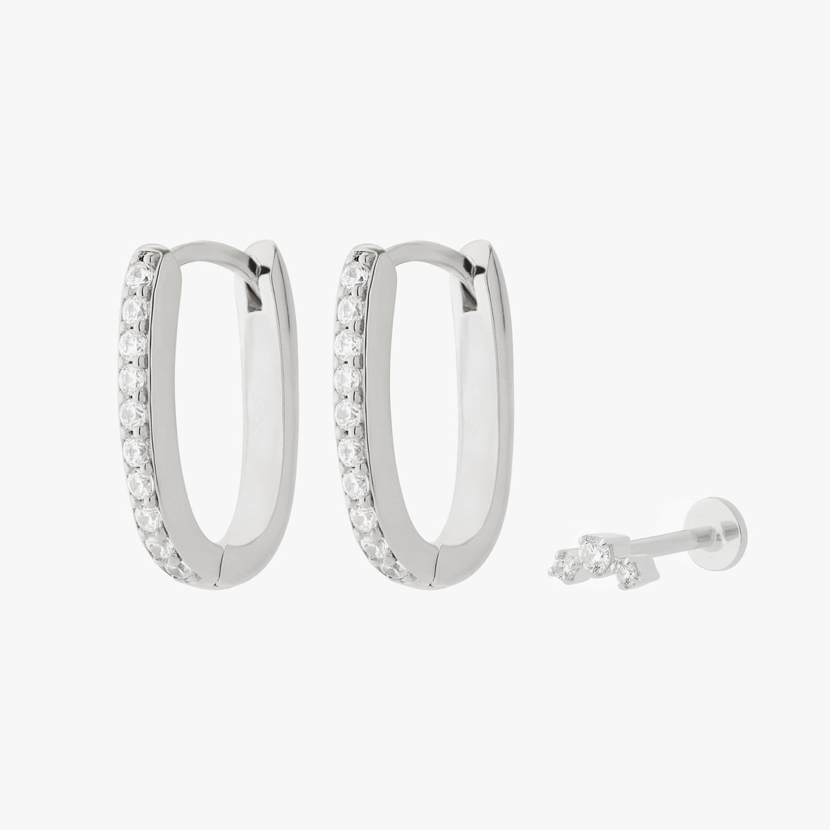 Silver earscape featuring a pair of Pave Oval Hoops and a micro cluster flatback stud with clear stones