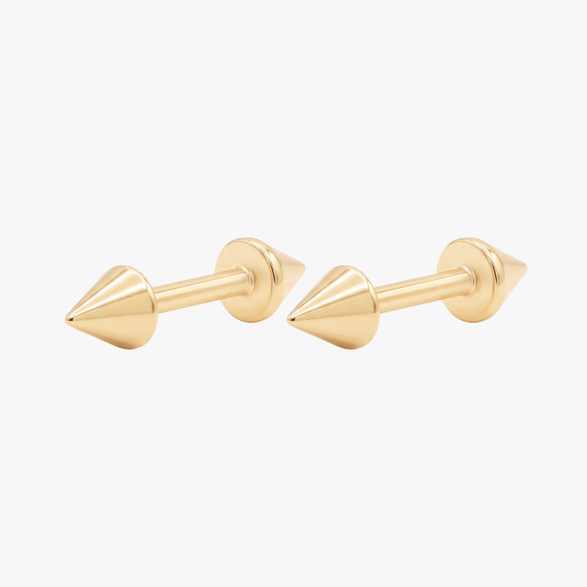 this image shows the side view of a pair of the 14k yellow gold plated reversible spike flatback. 