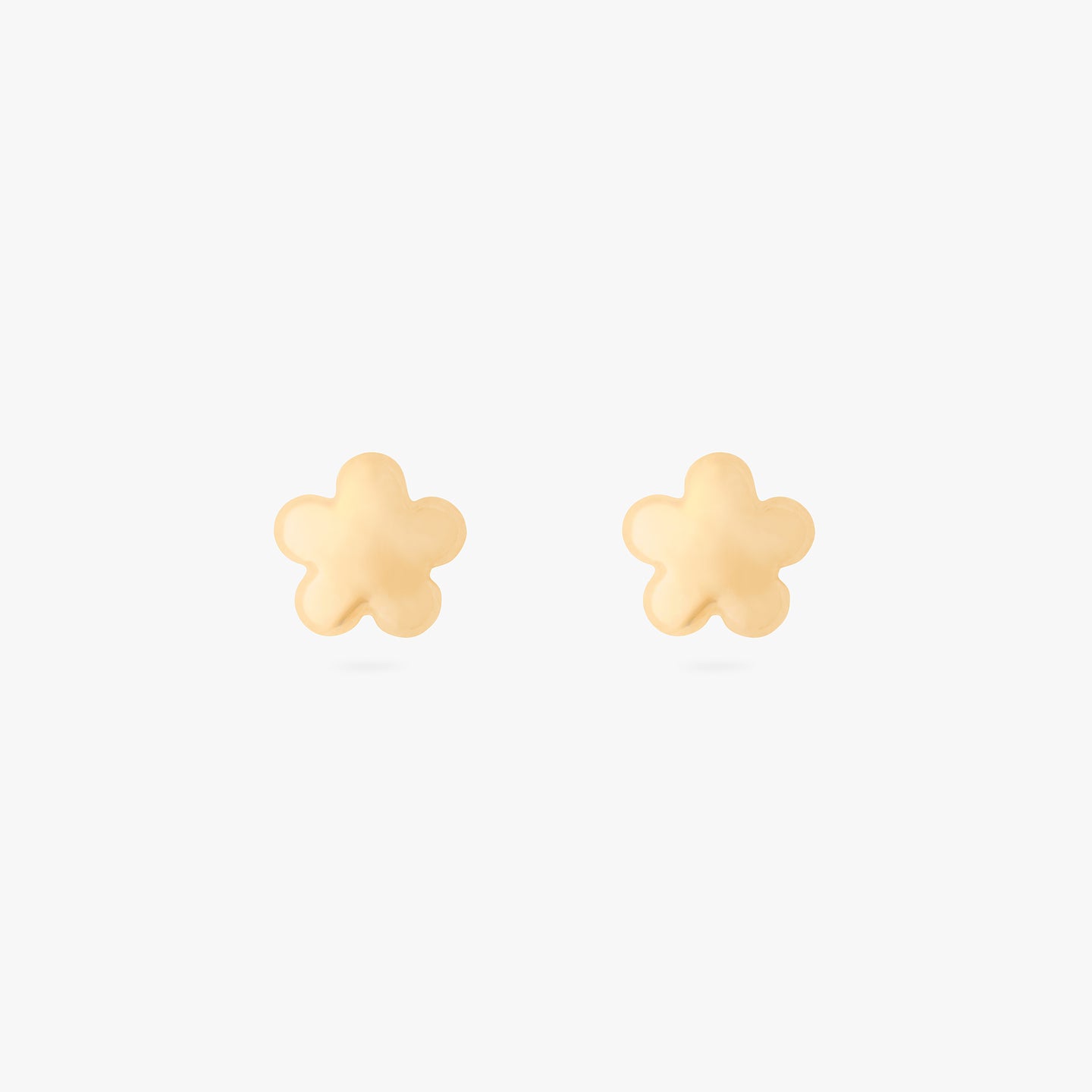 A pair of gold puffy daisy-shaped studs. [pair] color:null|gold