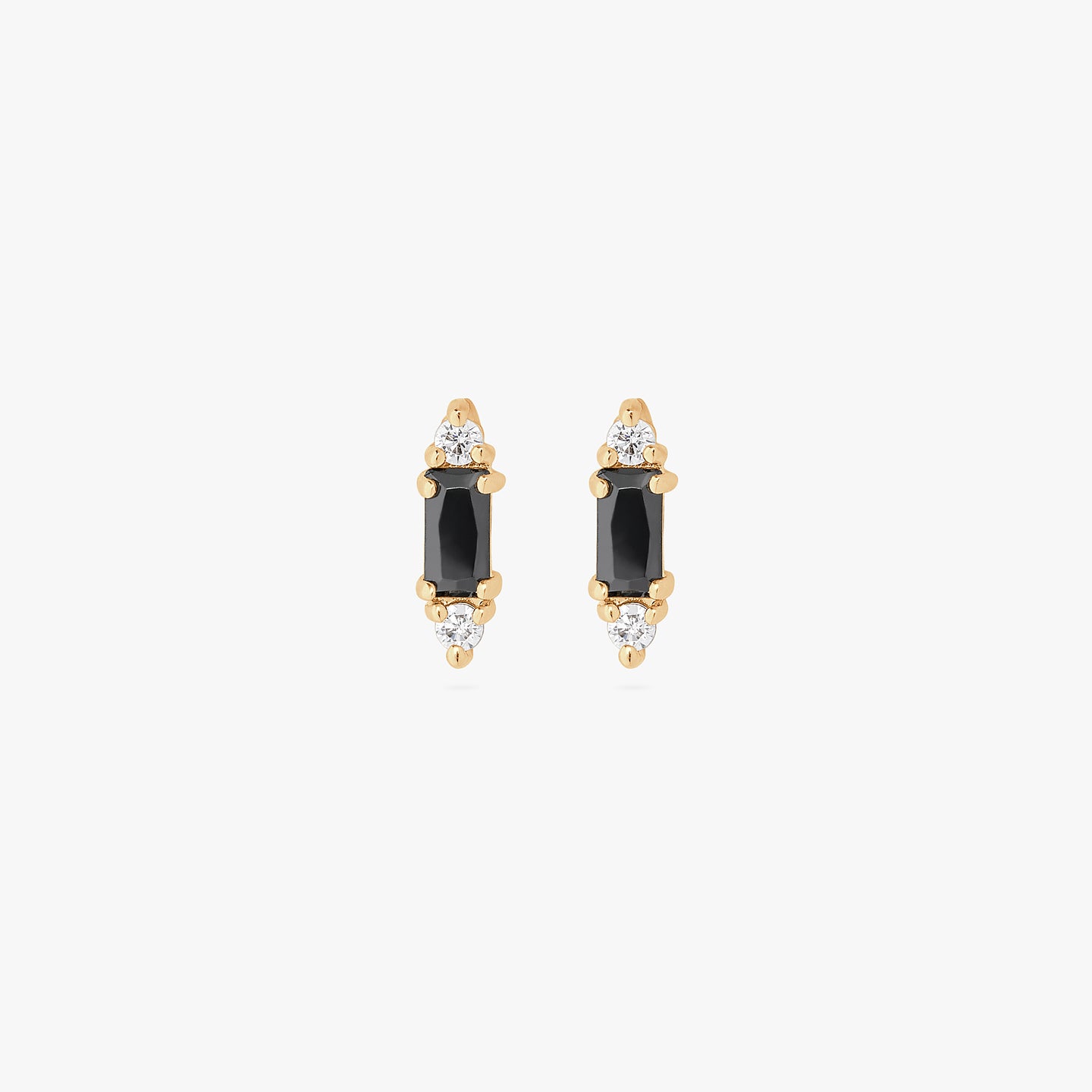 A pair of black baguette-shaped CZ studs with two gold/clear CZs on the end of the baguette. [pair] color:null|gold/black