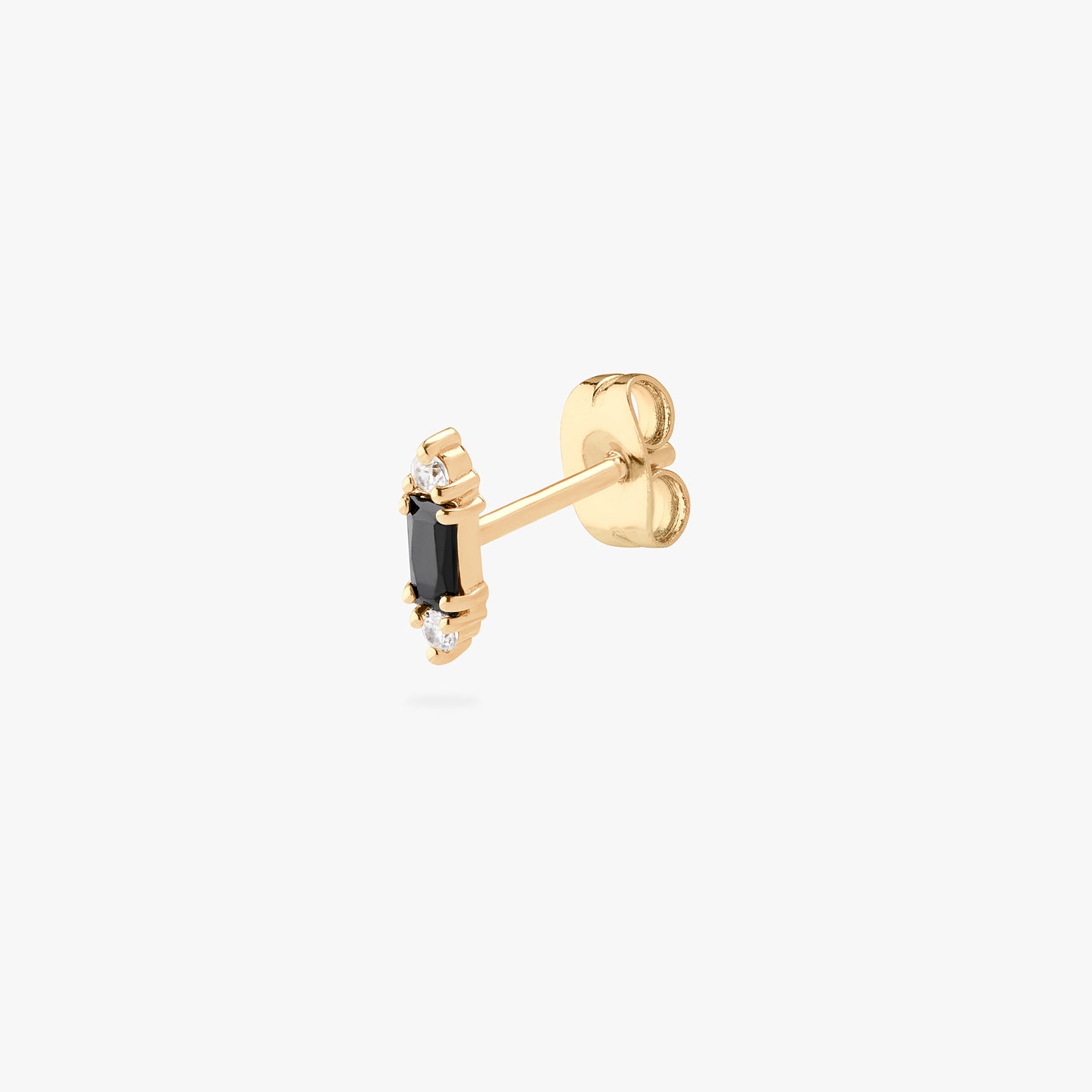 A black baguette-shaped CZ stud with two gold/clear CZs on the end of the baguette. color:null|gold/black