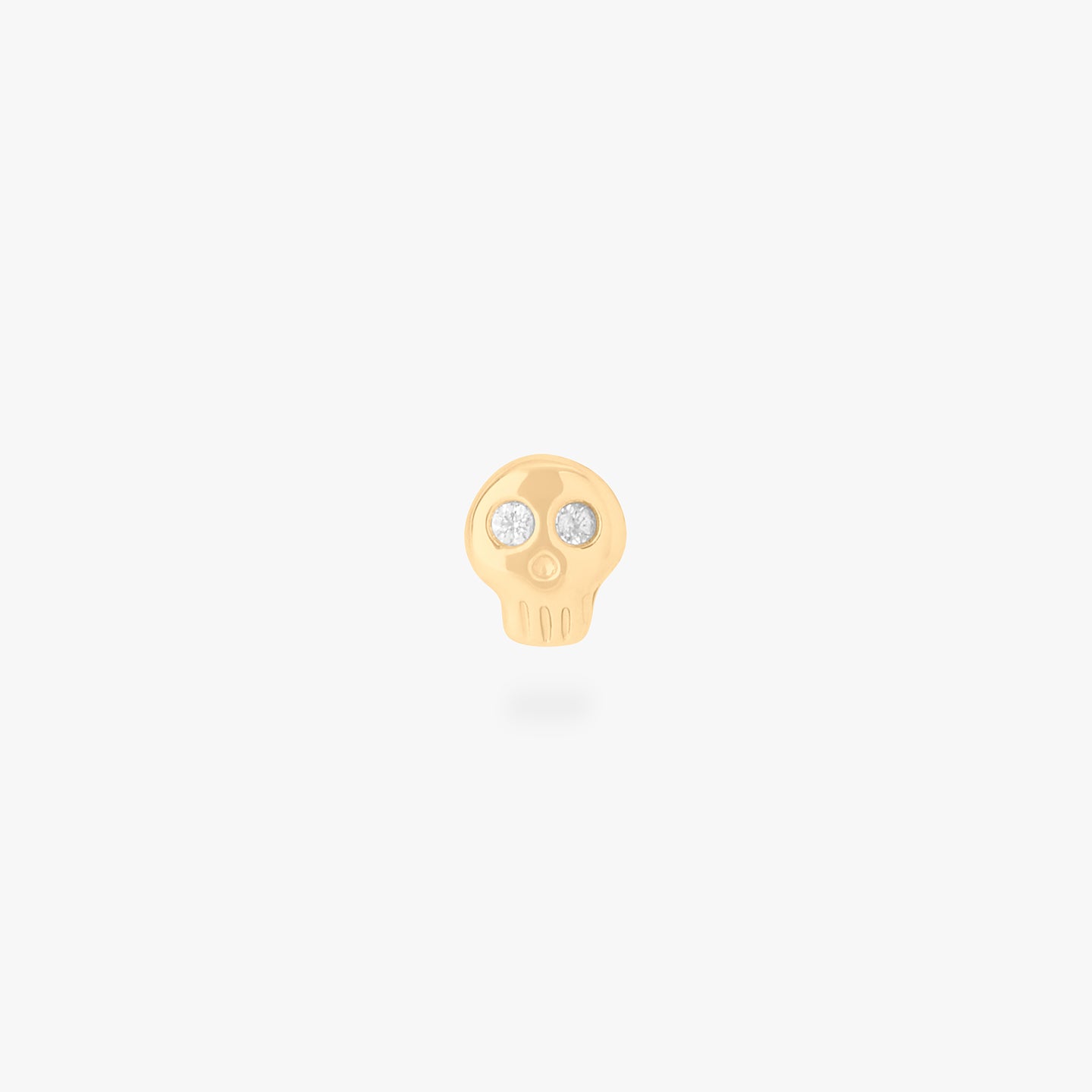 micro cz skull stud in gold with cz accent eyes color:null|gold/clear