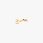Back angle of a gold flatback earring with an 'S' engraving on the post on a white background