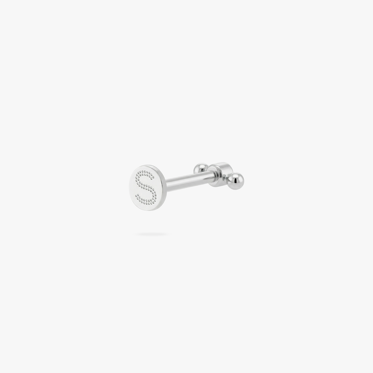 Back angle of a flatback stud with an engraved 'S' logo on the post 