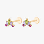This image shows the side view of a pair of the Anodized Stone Crown Flatback. The flatback has a green pear cz stone in the middle, two purple cz baguette stones on either side and two pink circular cz stones on the outer side of the baguette stones. 