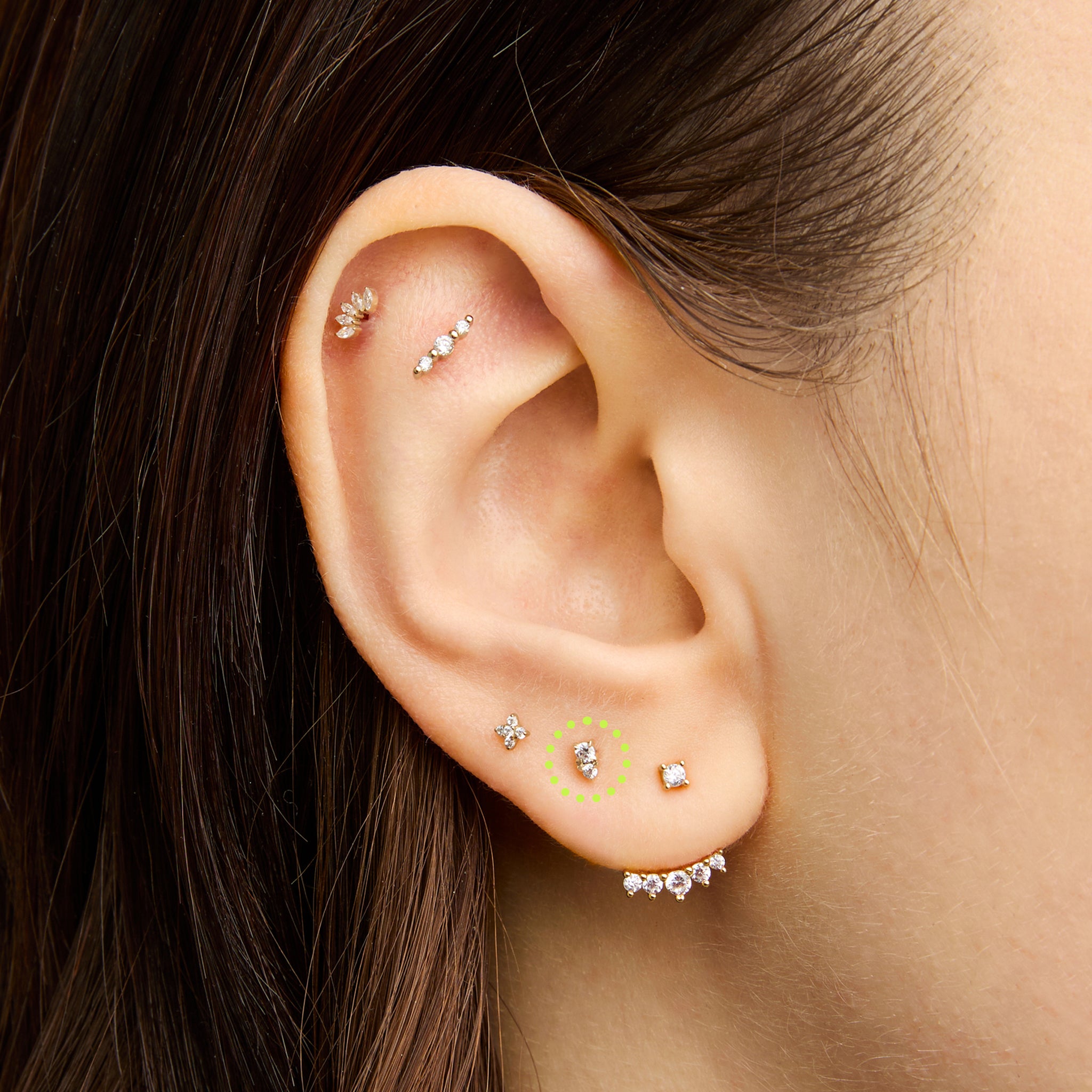 This is an image of a gold flatback stud with a clear stacked cz stone on ear. [hover] color:null|14k gold/clear
