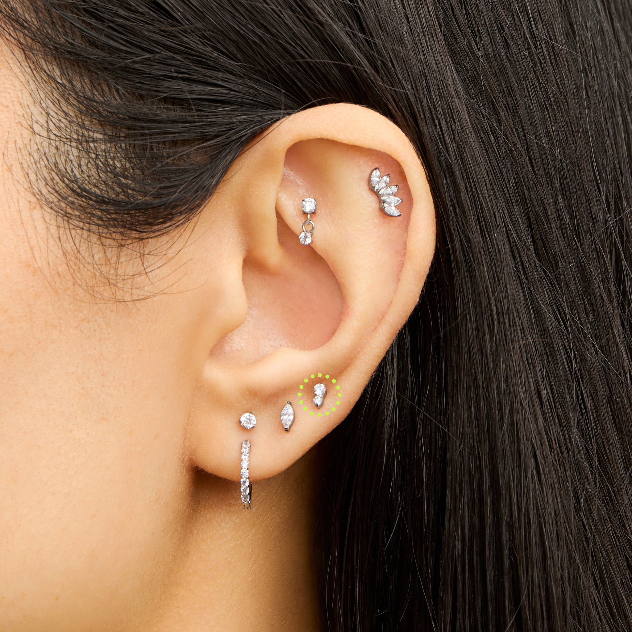 This is an image of a silver flatback stud composed of titanium with a clear cz stone stacked over a clear cz stone on ear. [hover] color:null|silver/clear