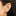 This is an image of an anodized pink heart-shaped flatback stud with a gold-toned labret on ear. [hover] color:null|pink