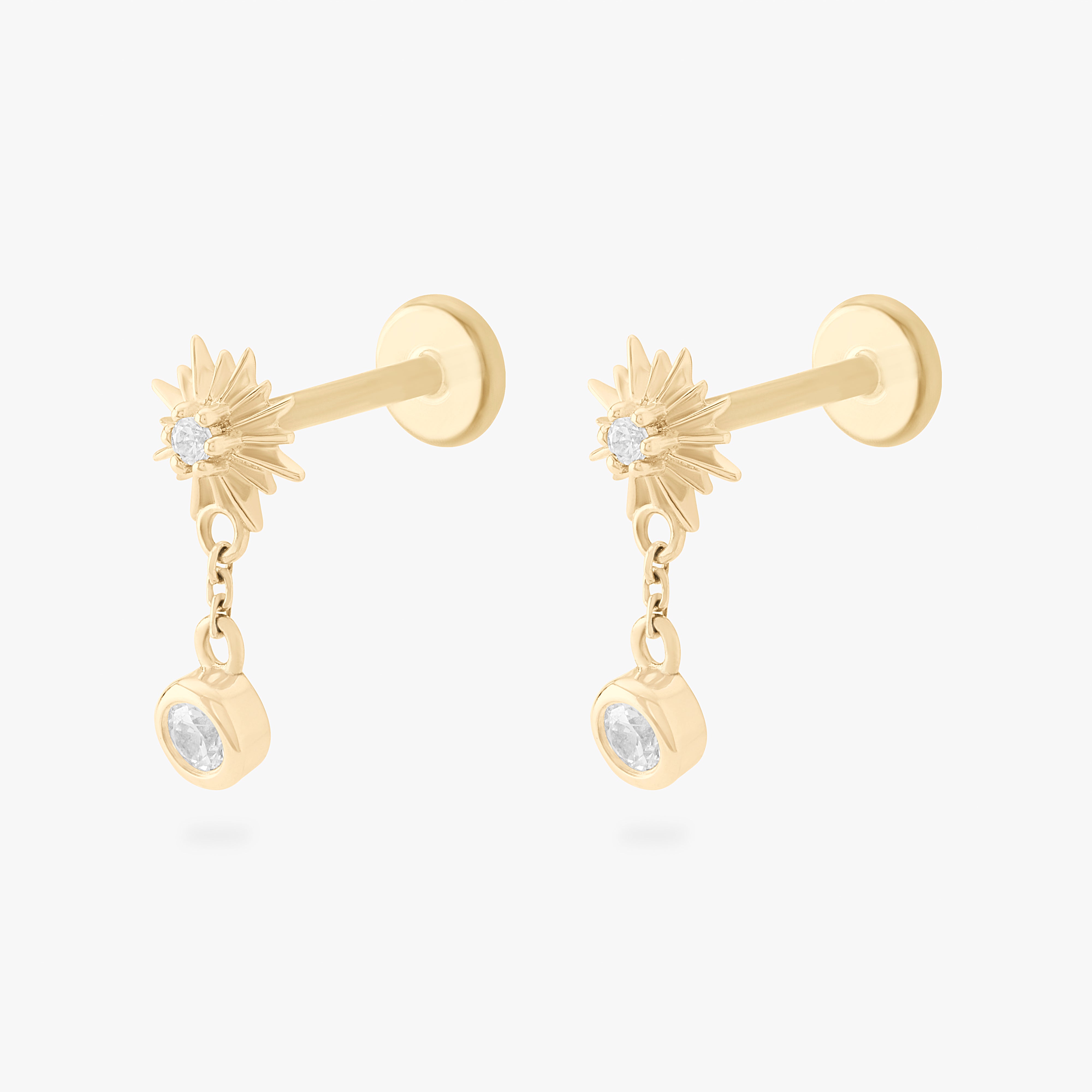 This is an image of a pair of 14k gold flatbacks that are shaped as a twinkle stars with clear czs and clear cz bezels dangling from them. [pair] color:null|14k gold/clear