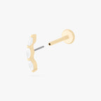 This is an image of a 14k gold flatback stud with 3 clear, pear-shaped cz's in a curved line. color:null|14k gold/clear