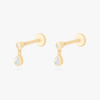 This is an image of a pair of 14k gold flatback studs with pear-shaped, bezel set clear cz stones dangling from other pear-shaped, bezel set clear cz stones.. [pair] color:null|14k gold/clear
