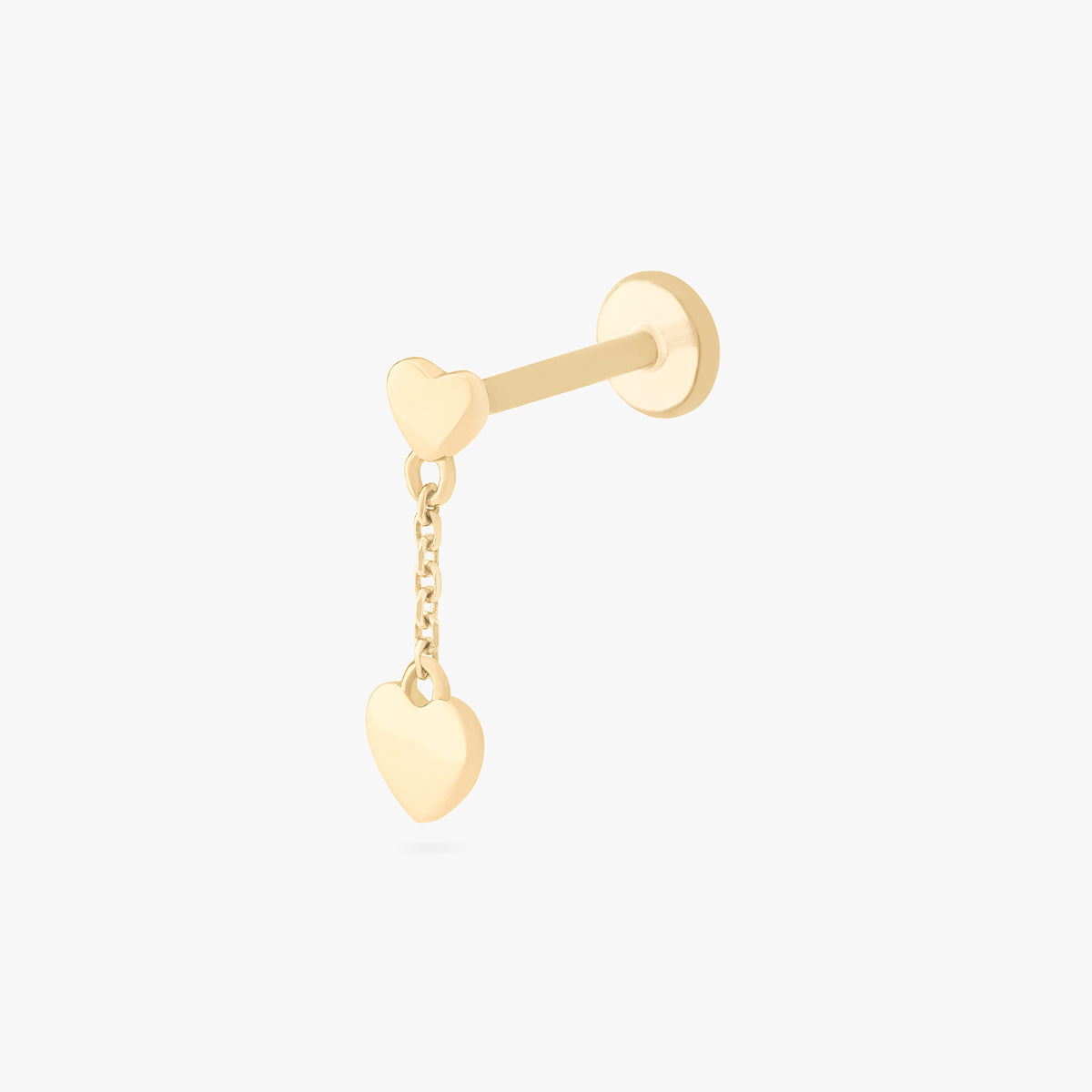 This is an image of a 14k gold flatback that is heart shaped with a gold shaped heart dangling from it. color:null|14k gold/clear