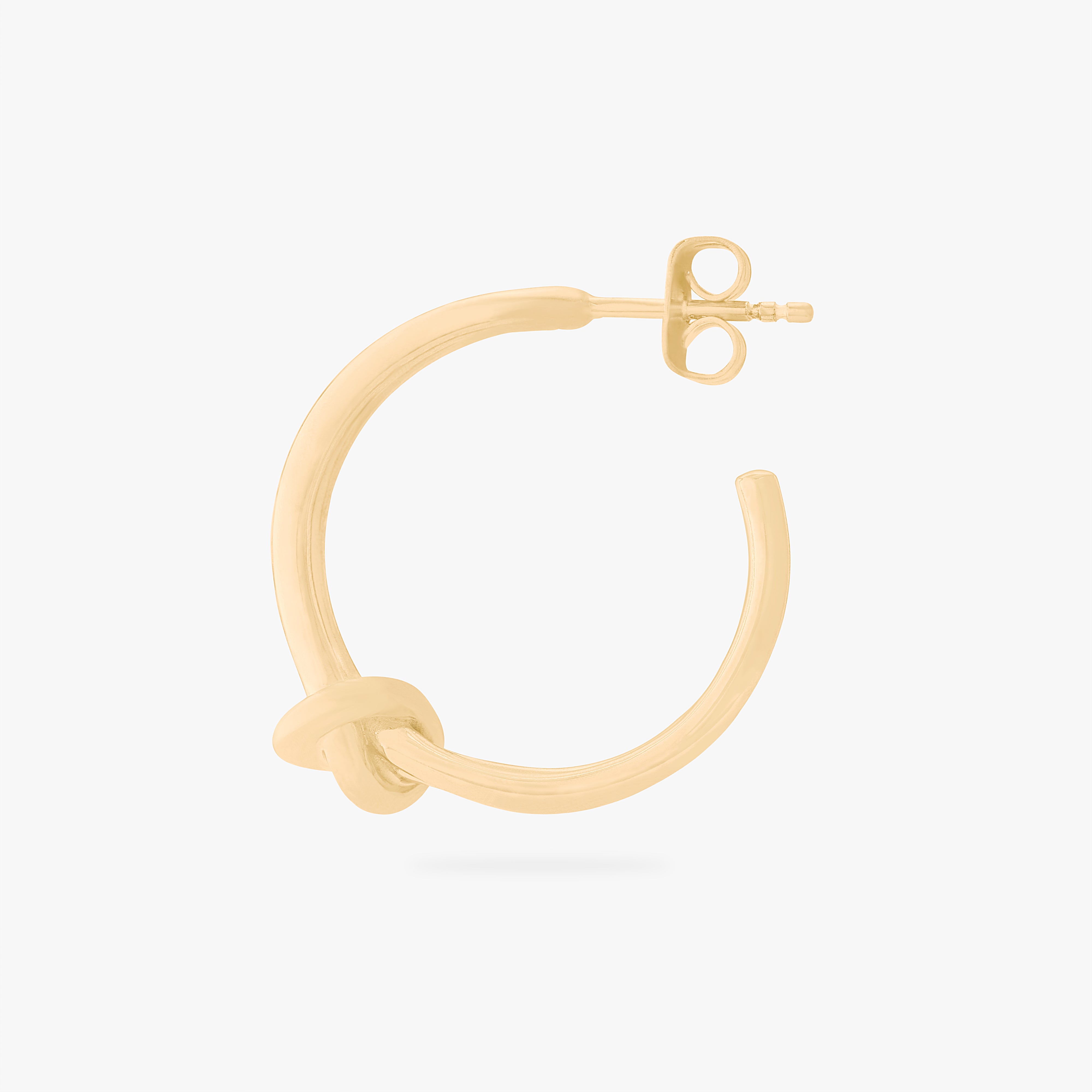 This is an image of a gold hoop butterfly back earring with a knot detail in the front. color:null|gold