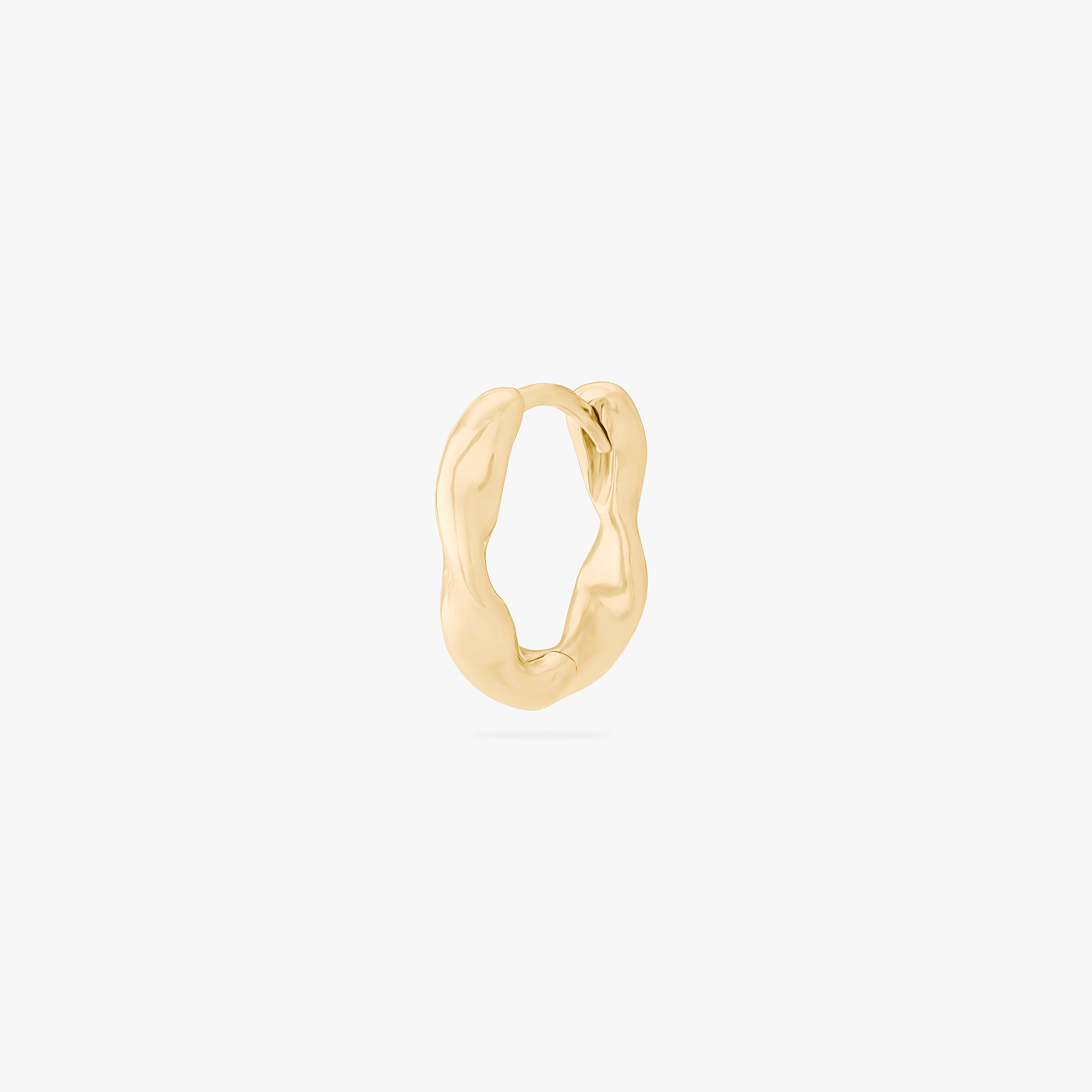 This is an image of a gold toned hoop earring that has a twist detail. color:null|gold