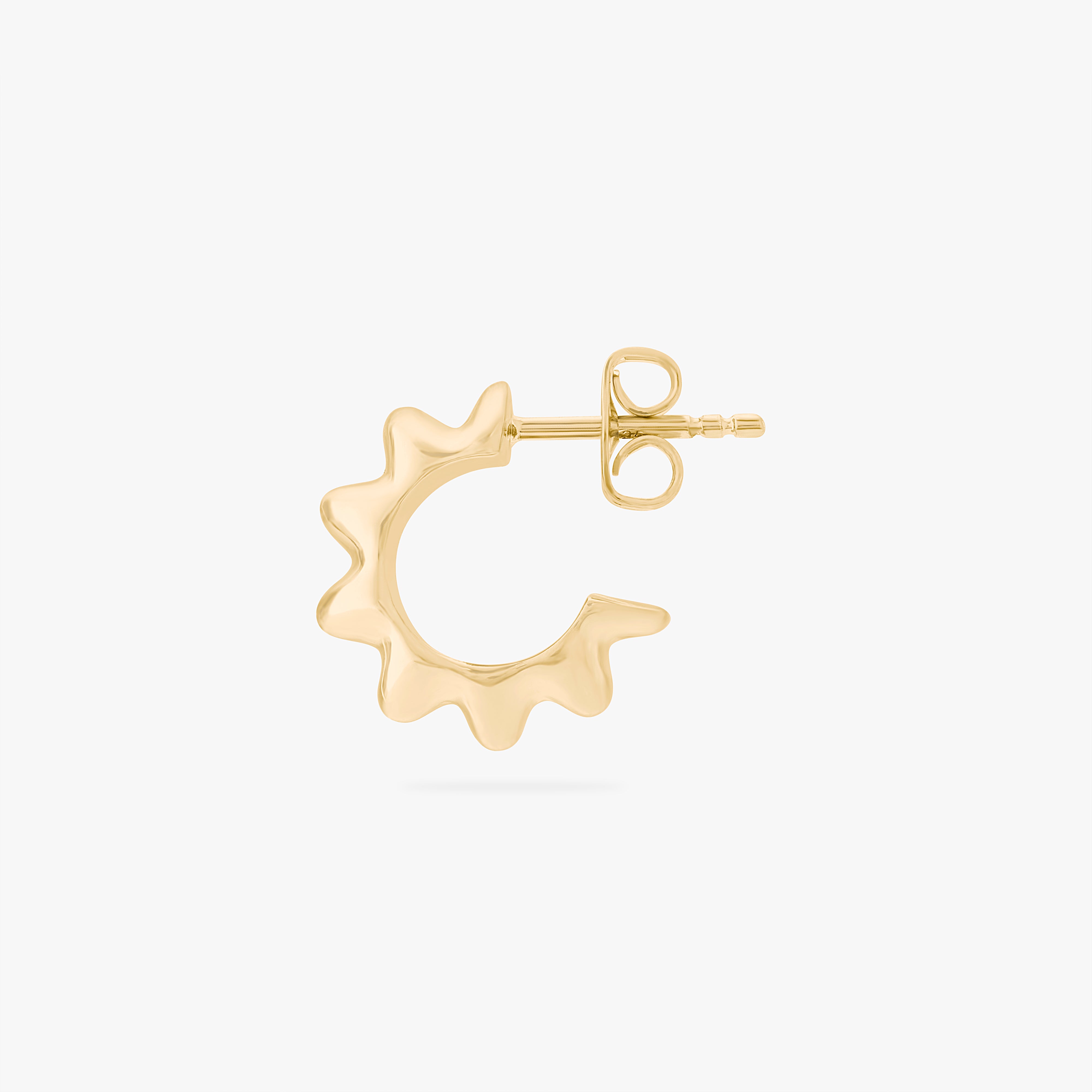 This is an image of a gold toned butterfly back earring that has a ridged detailing along the edge. color:null|gold