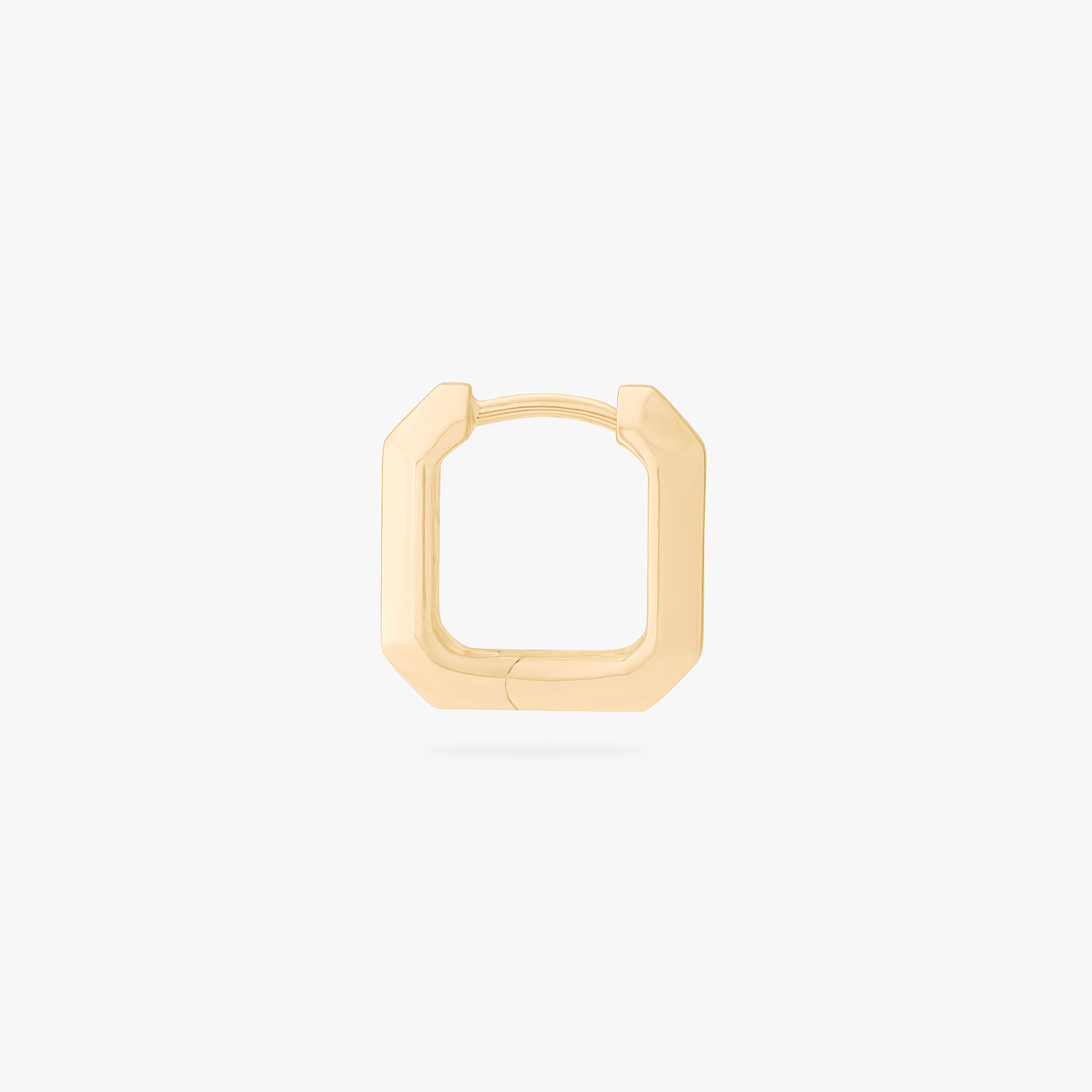 This is an image of a gold toned huggie that is square shaped. color:null|gold